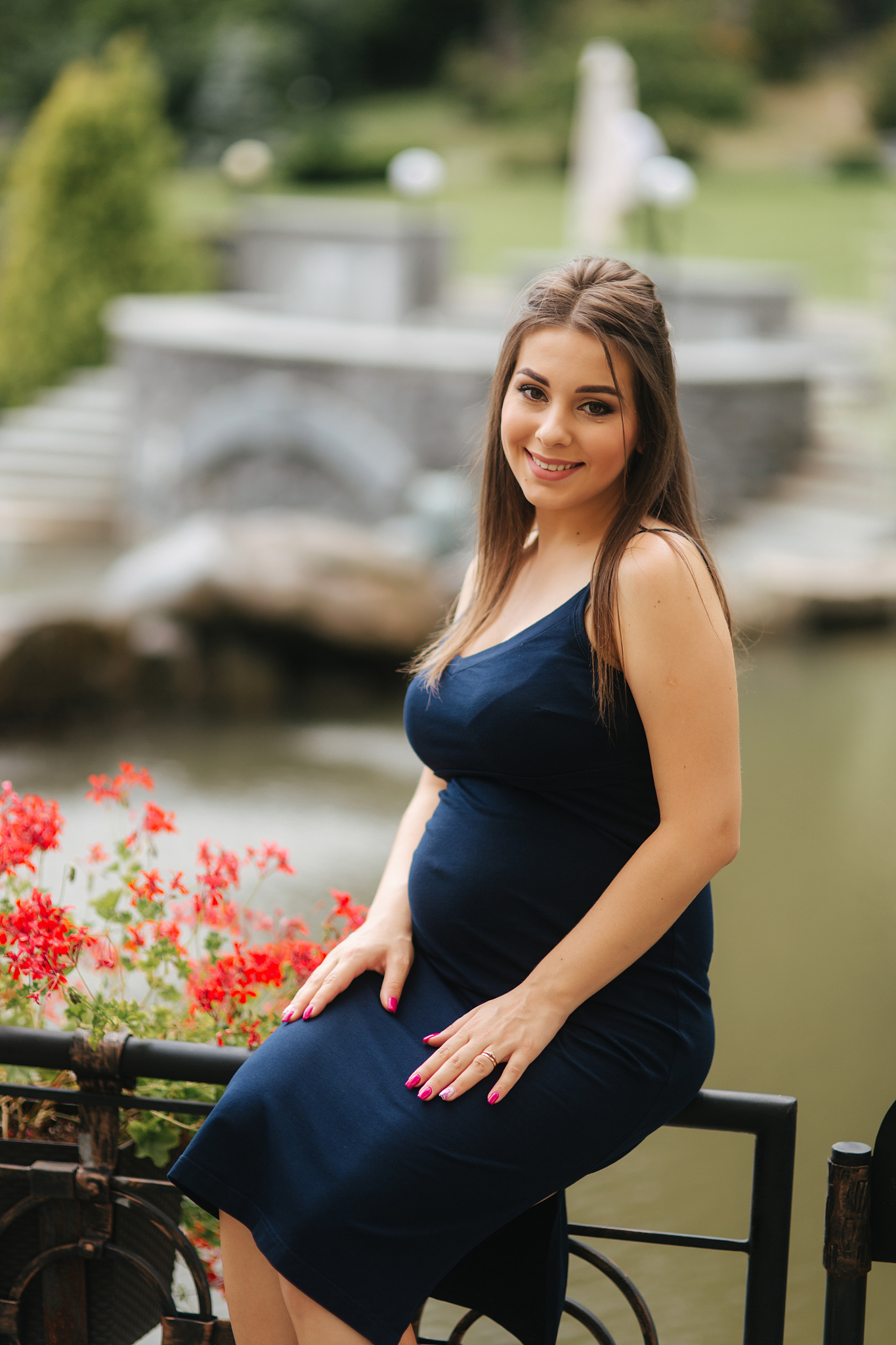 beautiful pregnant lady in blue dress smile. tenderness woman wa