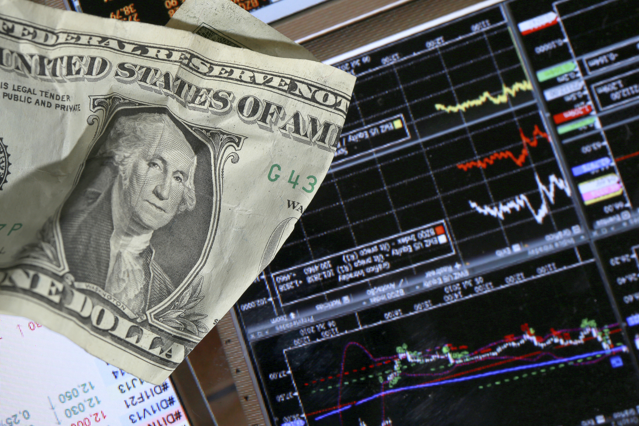 stock market graph with dollars