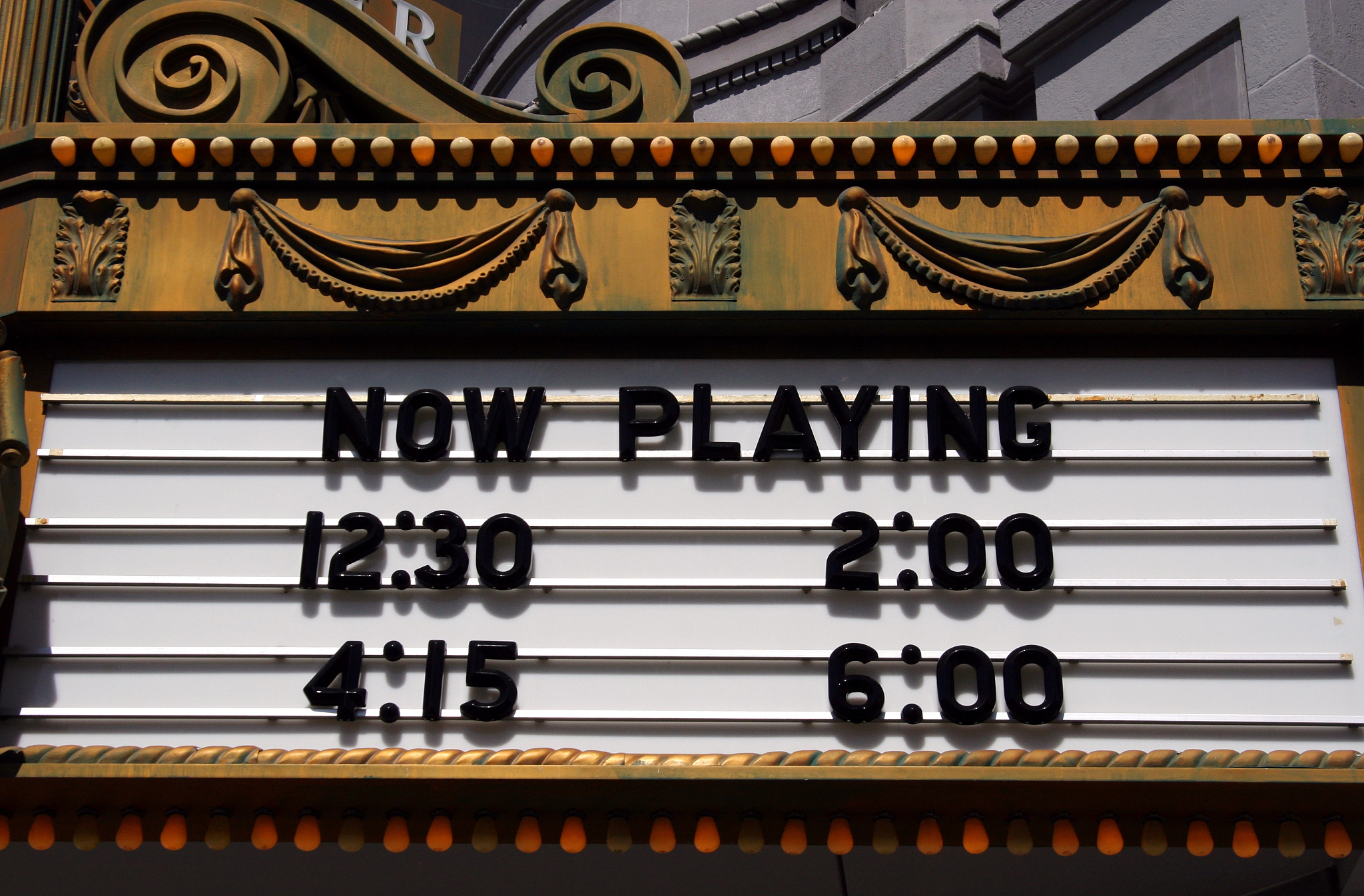 theater marquee, now playing