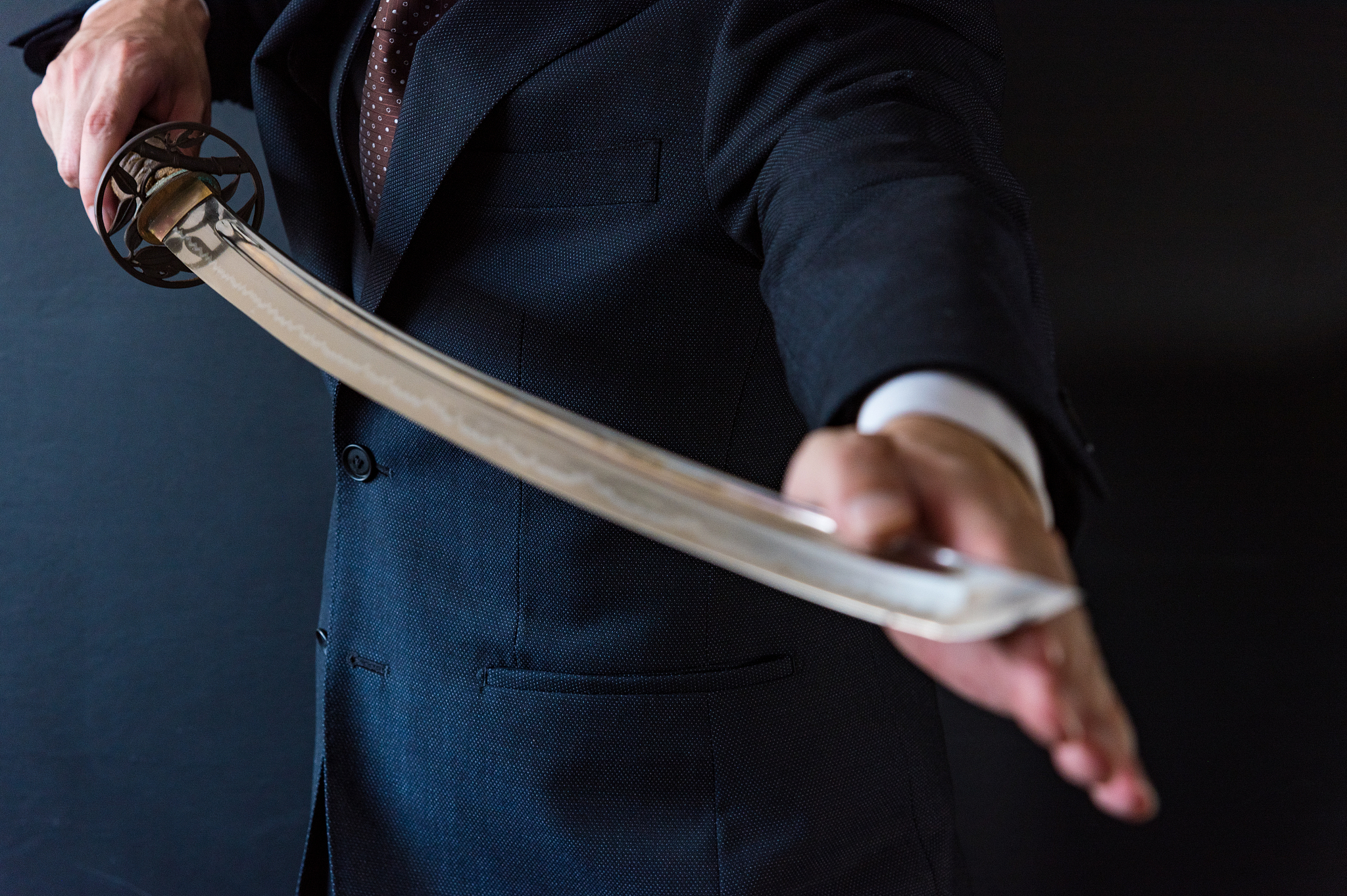 the man holding japanese sword
