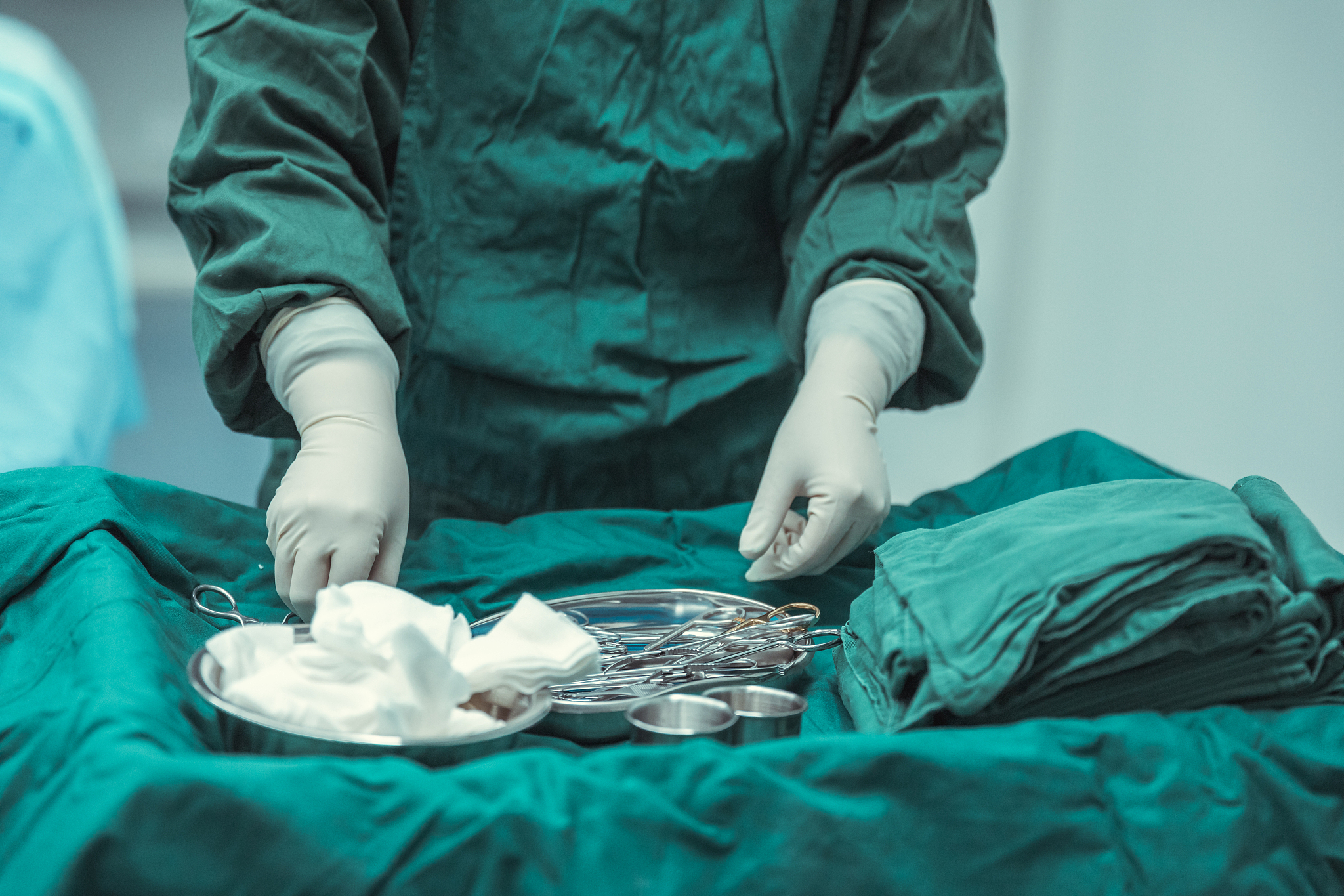 close-up of scrub nurse taking medical instruments,surgery and e