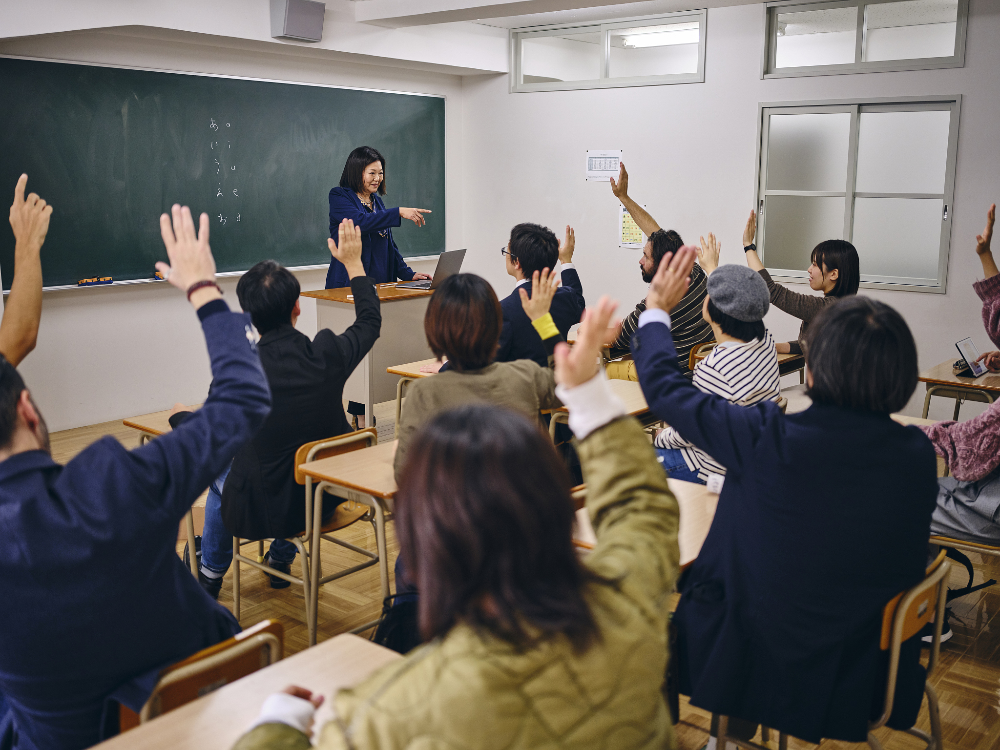 group of adult students in a japanese classroom