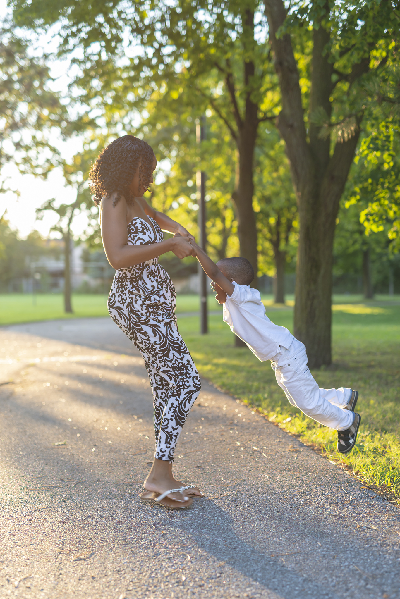 woman and toddler son playing outside