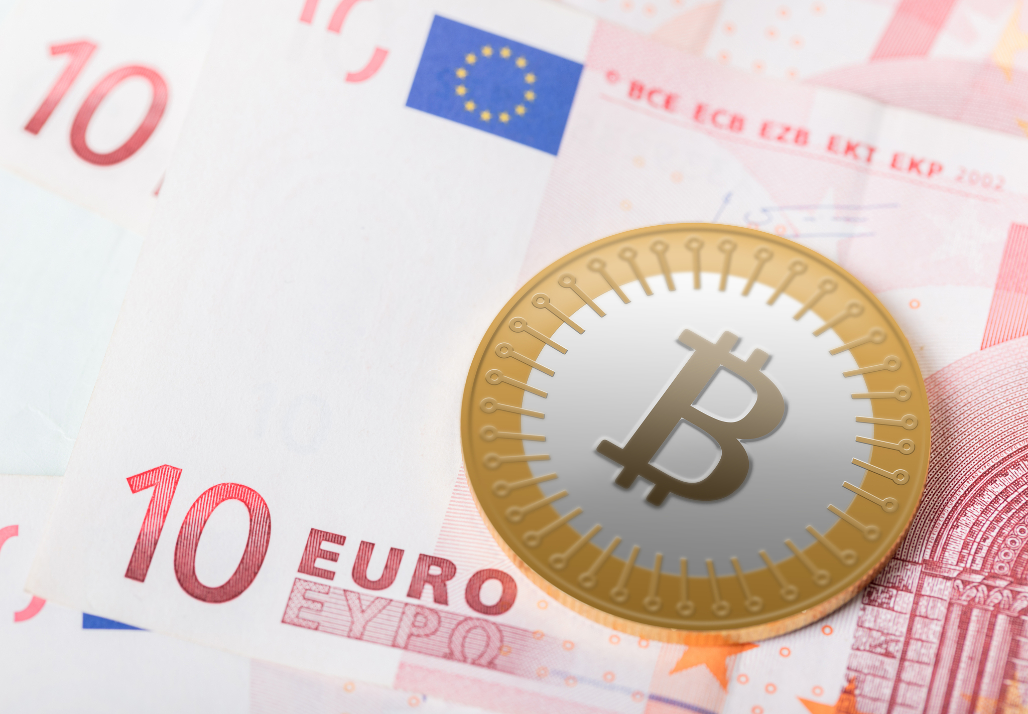bitcoin on background of euro