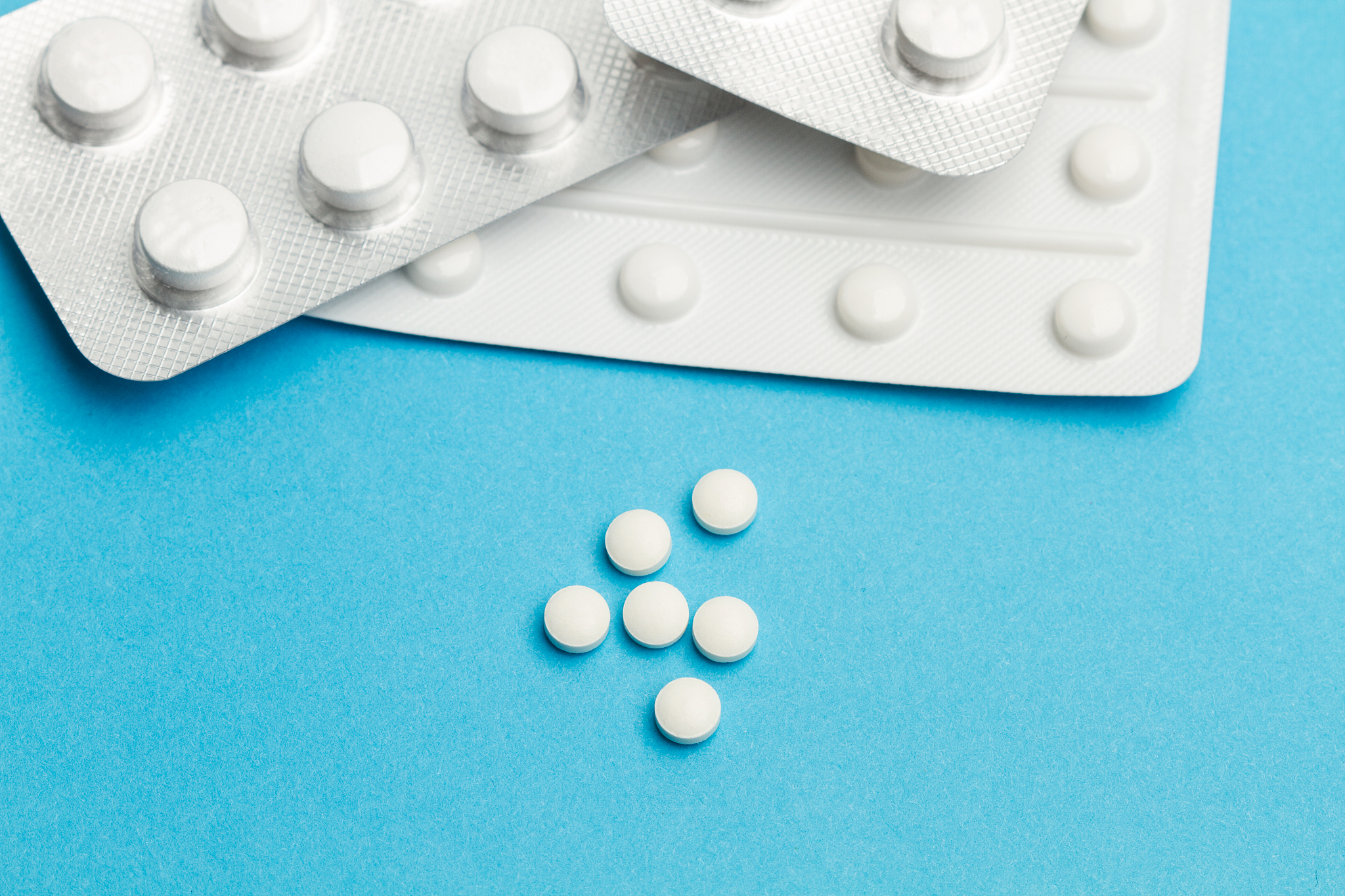 medical pills on a light blue background