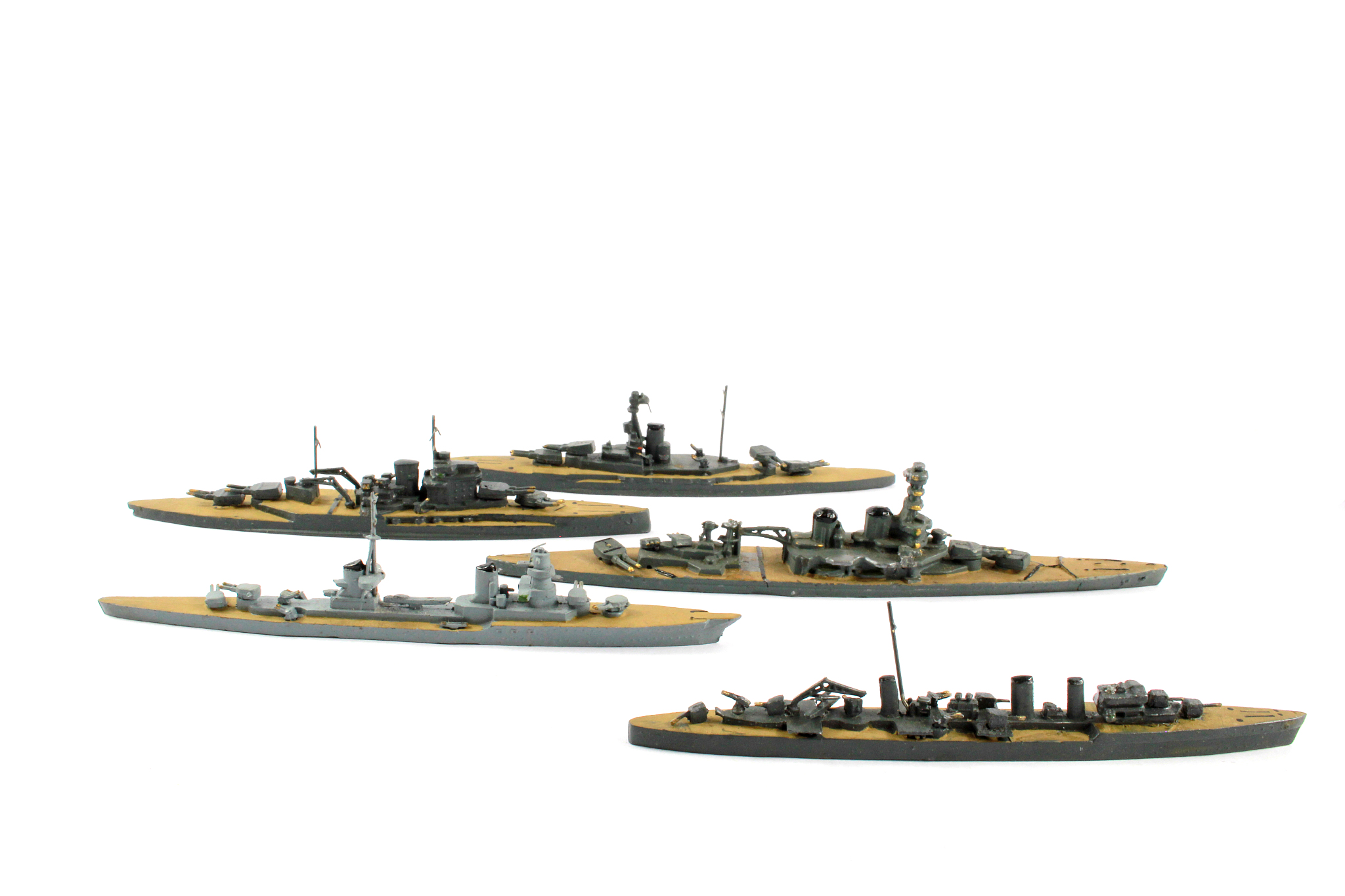 vintage toy lead battleships on white background