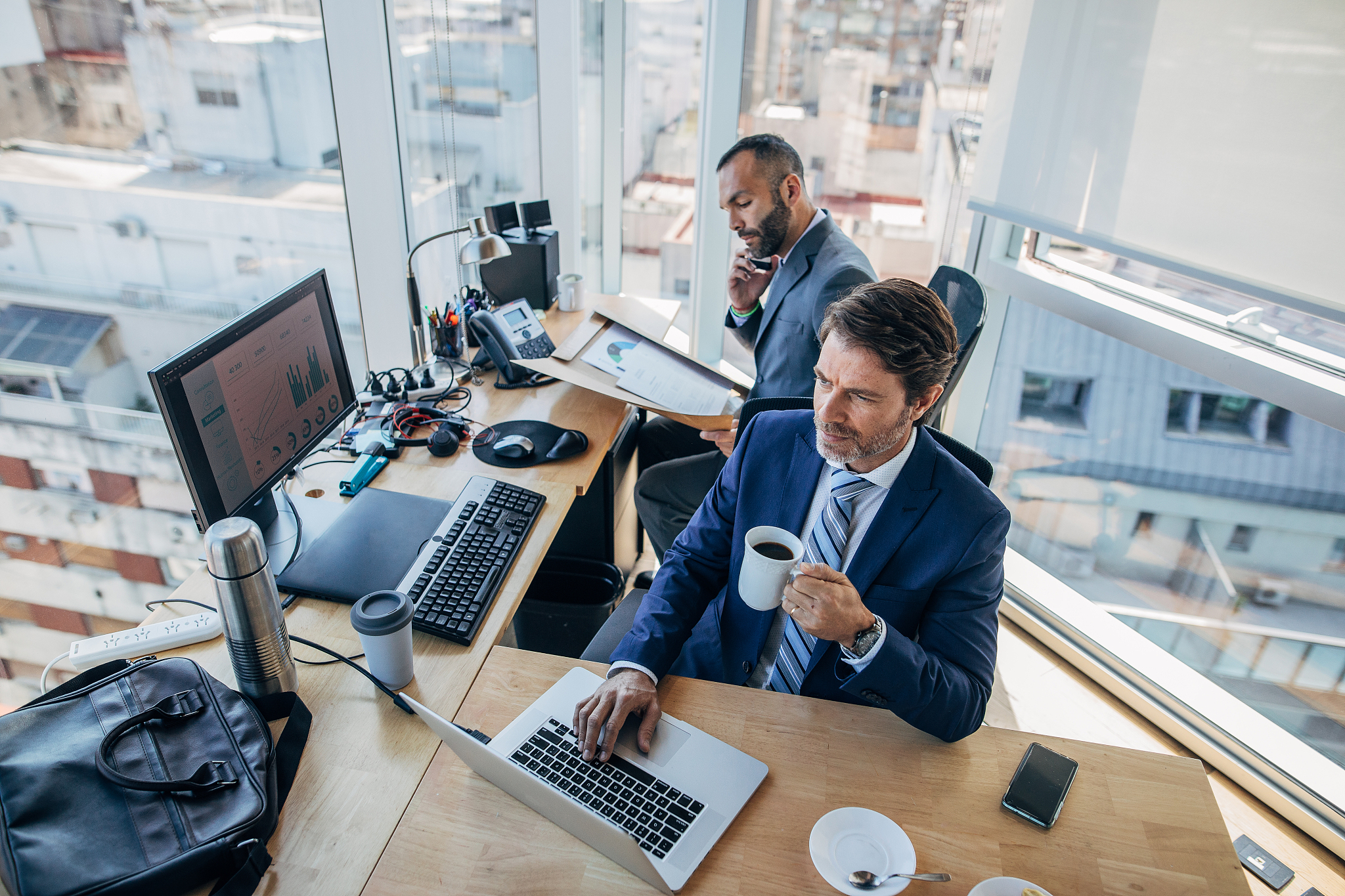 two businessmen working together in office