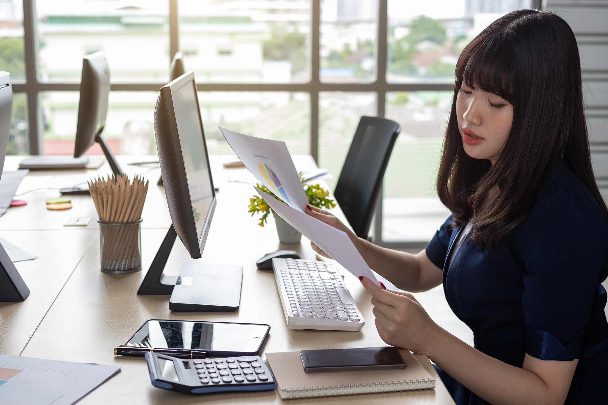 businesswoman working on table in office
