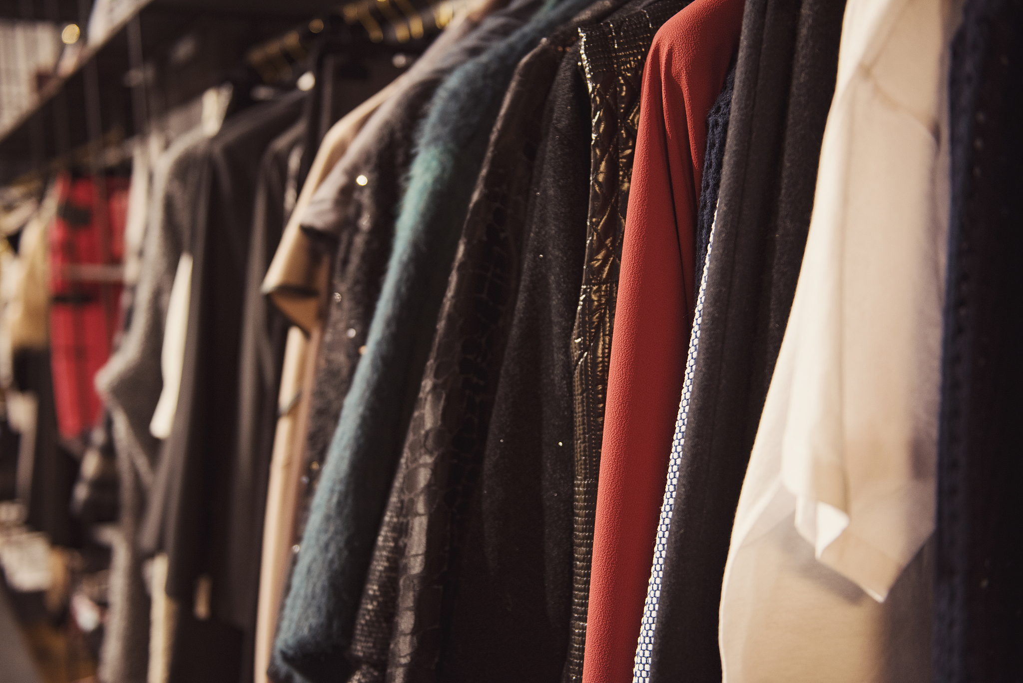 women clothing  in a retail shop. fashion and shopping concept.