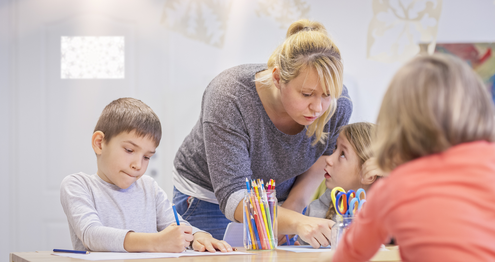students and teacher in classroom