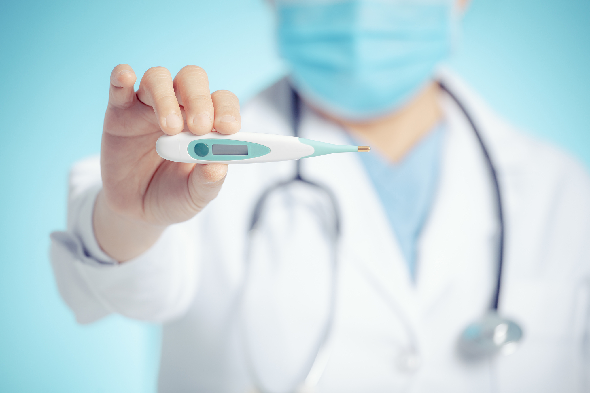doctor showing digital thermometer for medical exam concepts