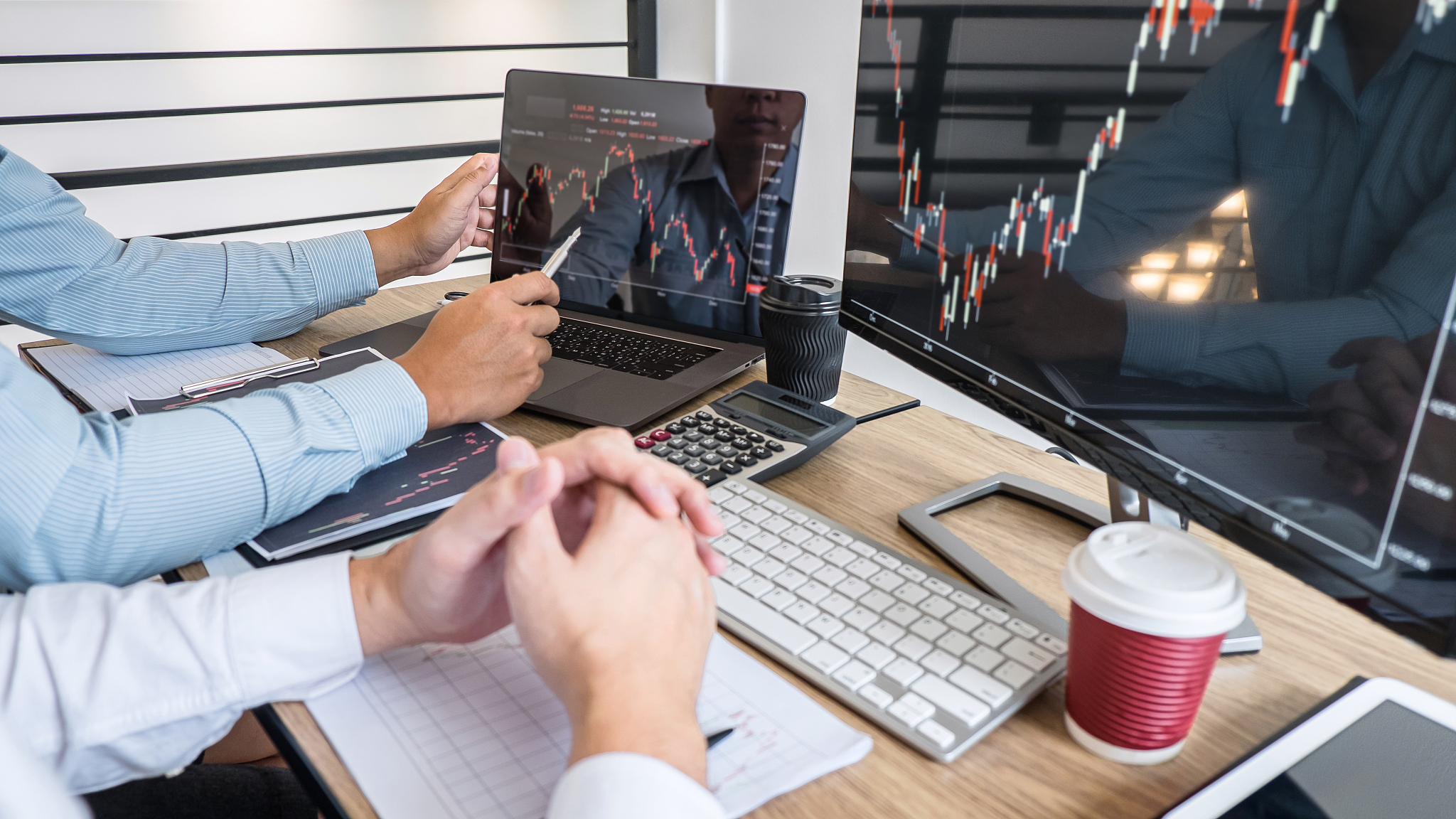 high angle view businessman pointing at computer monitor while s