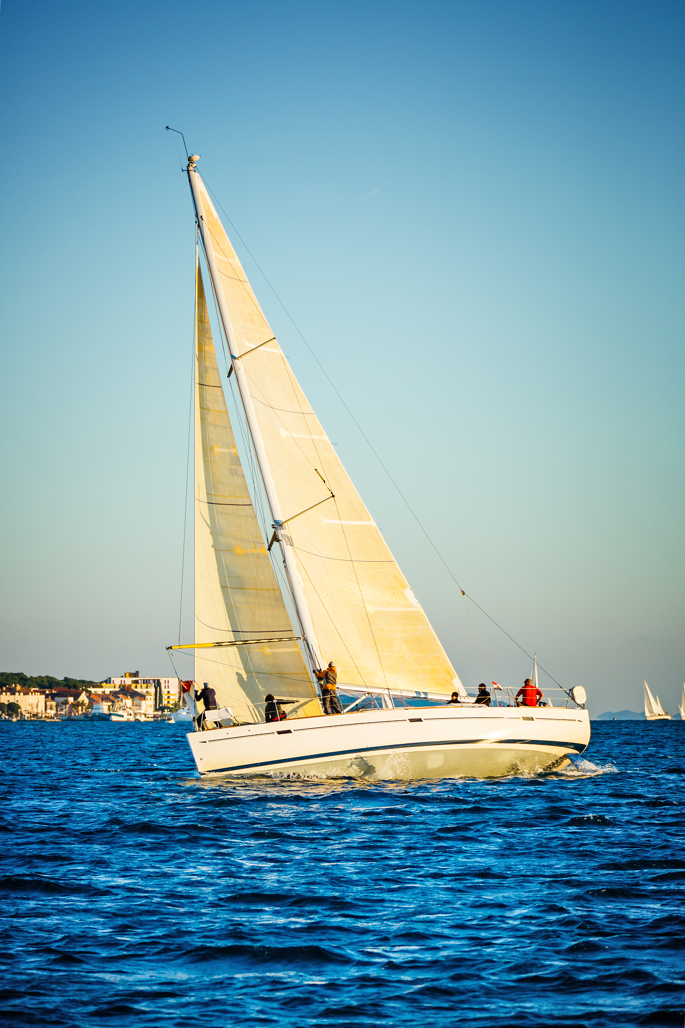 sailing crew on sailboat on regatta