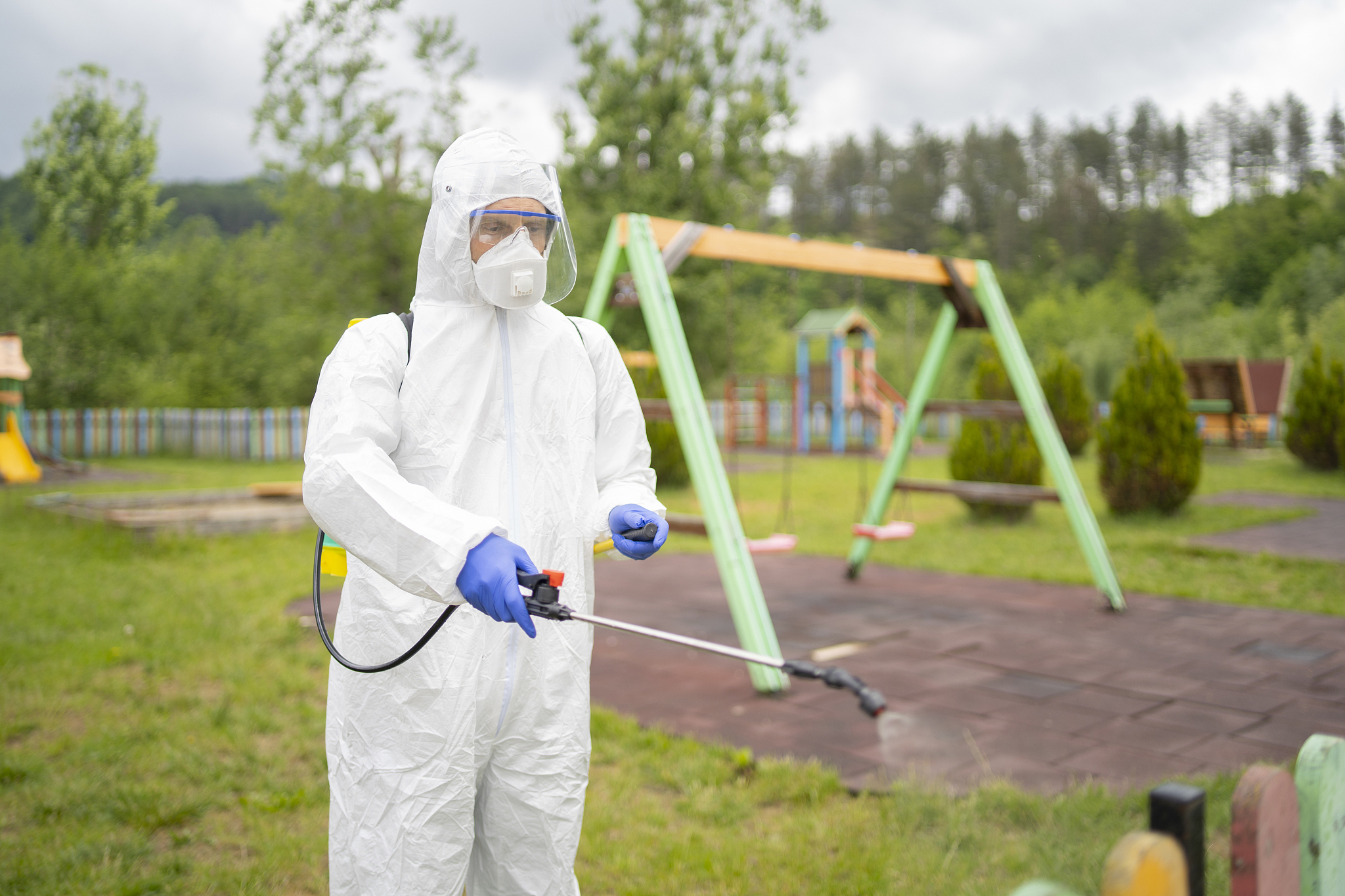 covid-19 disinfection of parks concept. service staff disinfecti