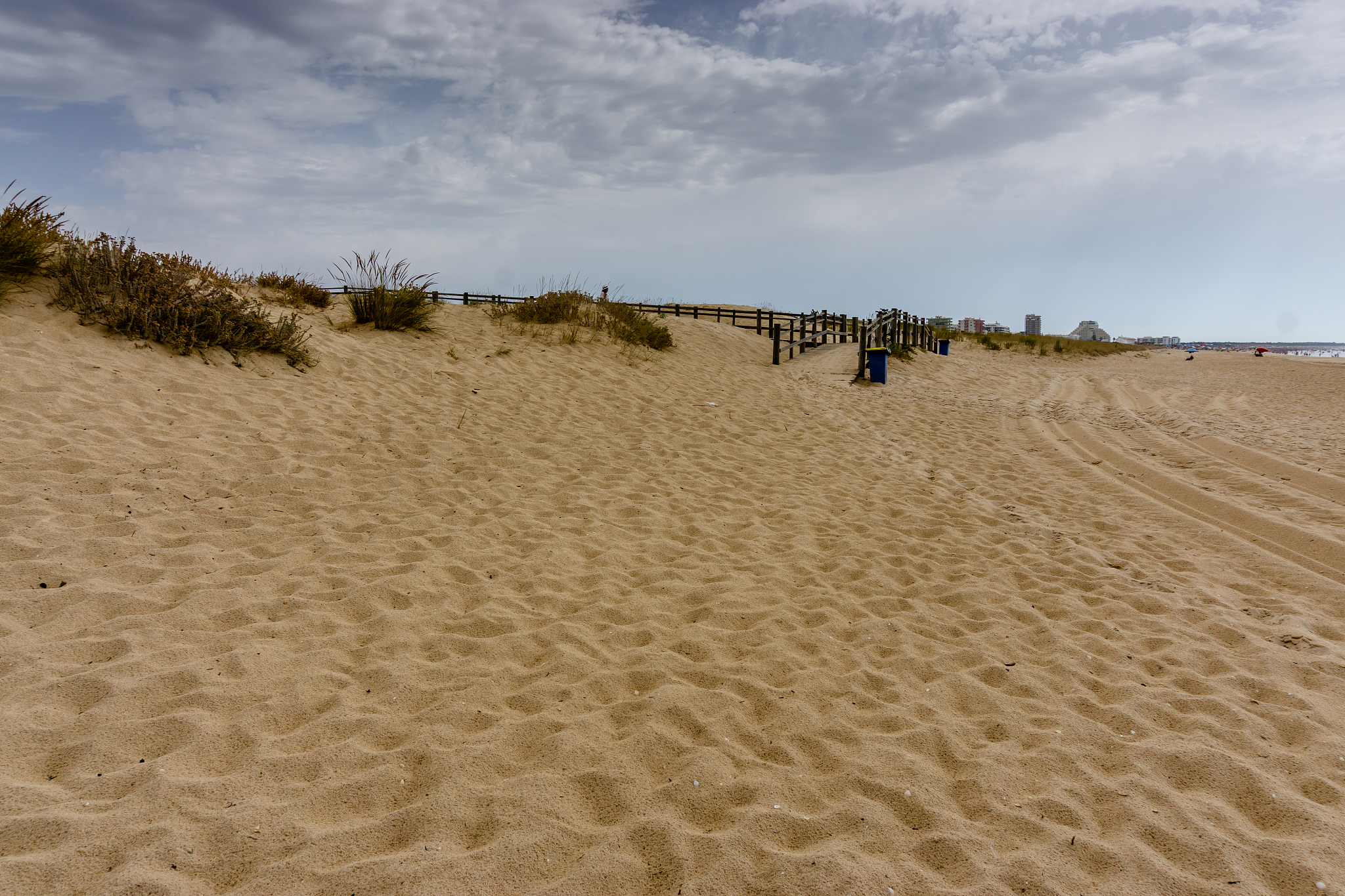 sand dunes and sea at sunset in green beach. castro marim, algar