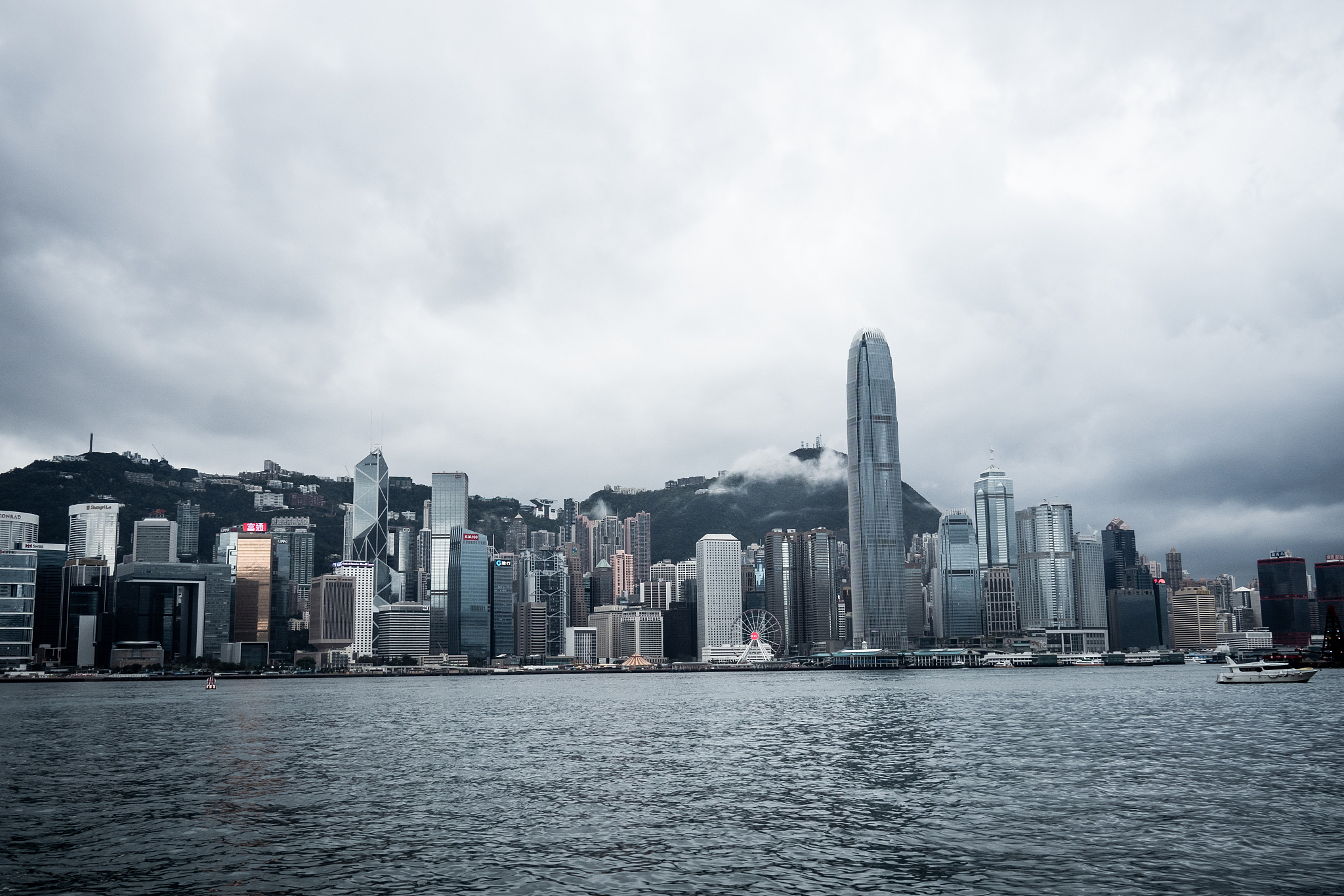 hong kong / china - feb 19 2019: victoria harbour skyline panora