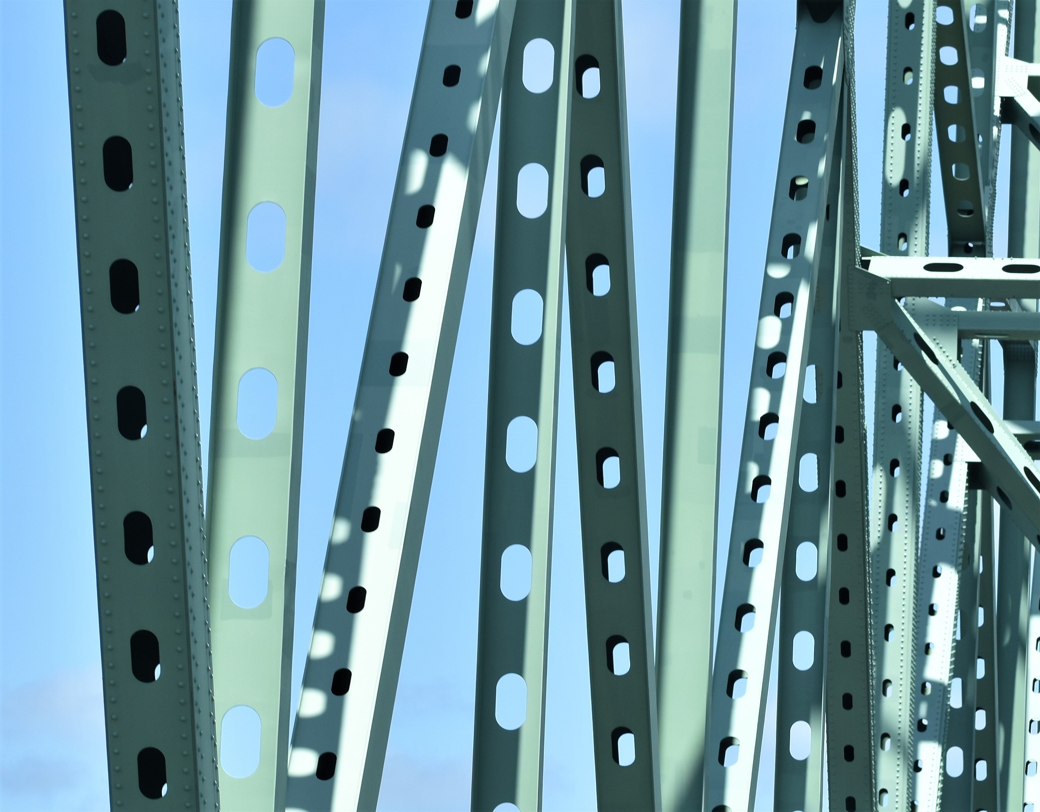 green metal bridge structures.