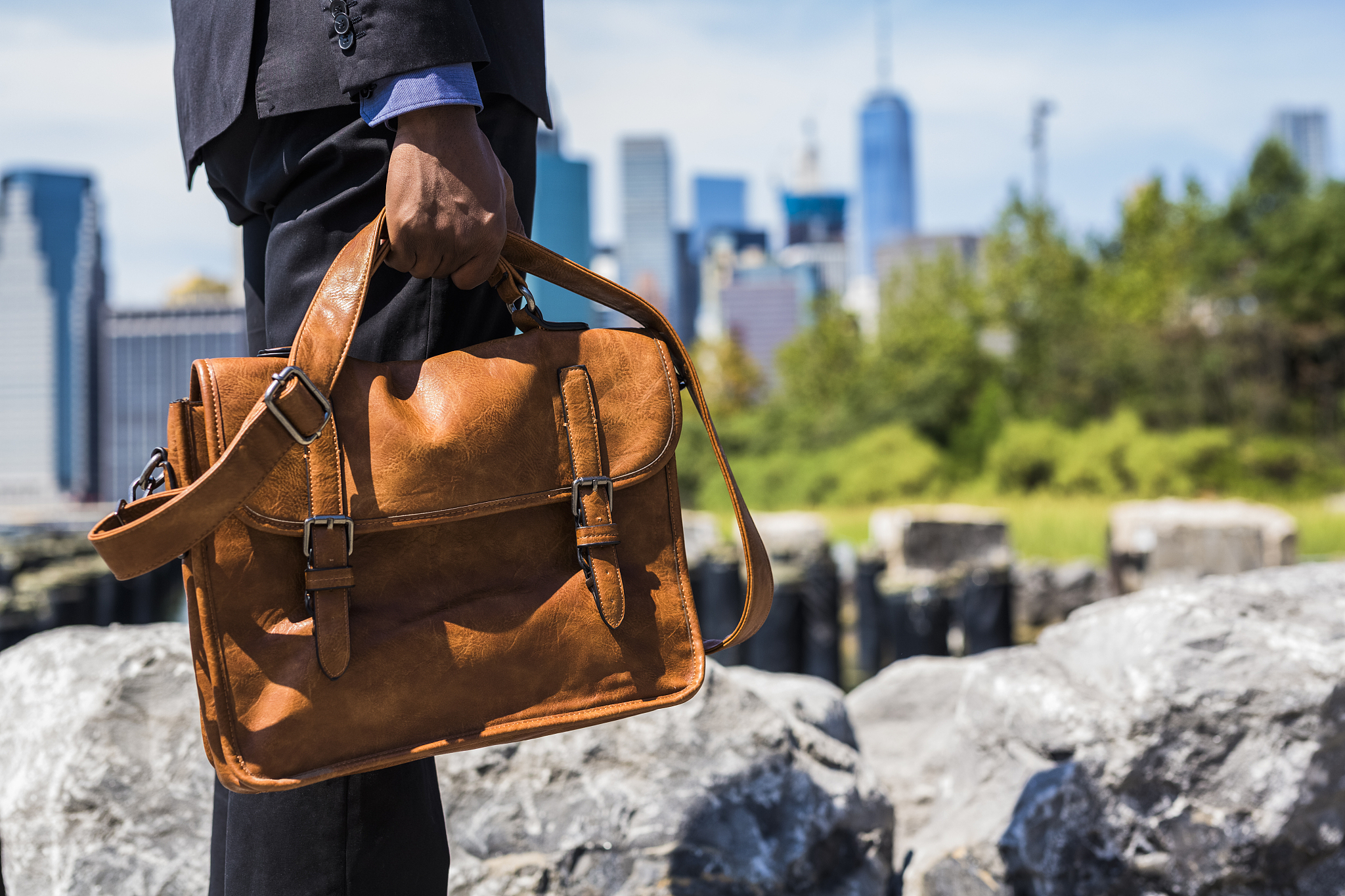 usa, brooklyn, businessman with briefcase standing in front of m
