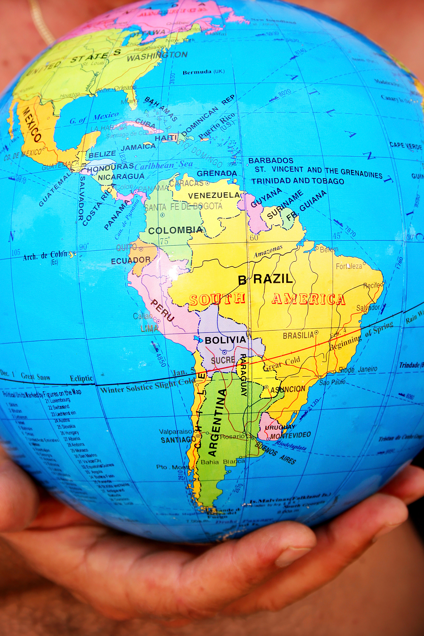 globe on hand showing africa and south america