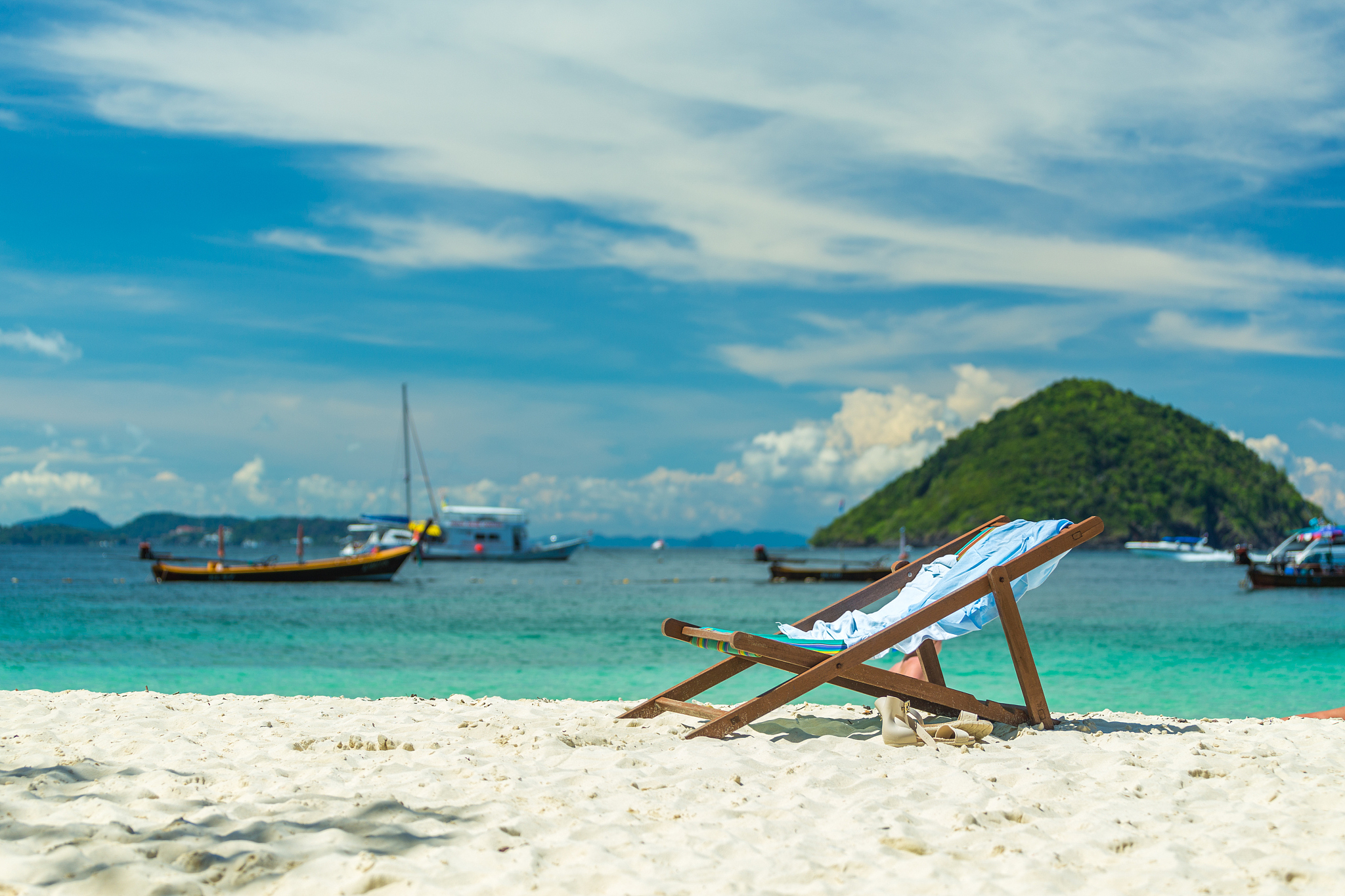 sunbeds on a paradise island, a sunny day on the beach of the re