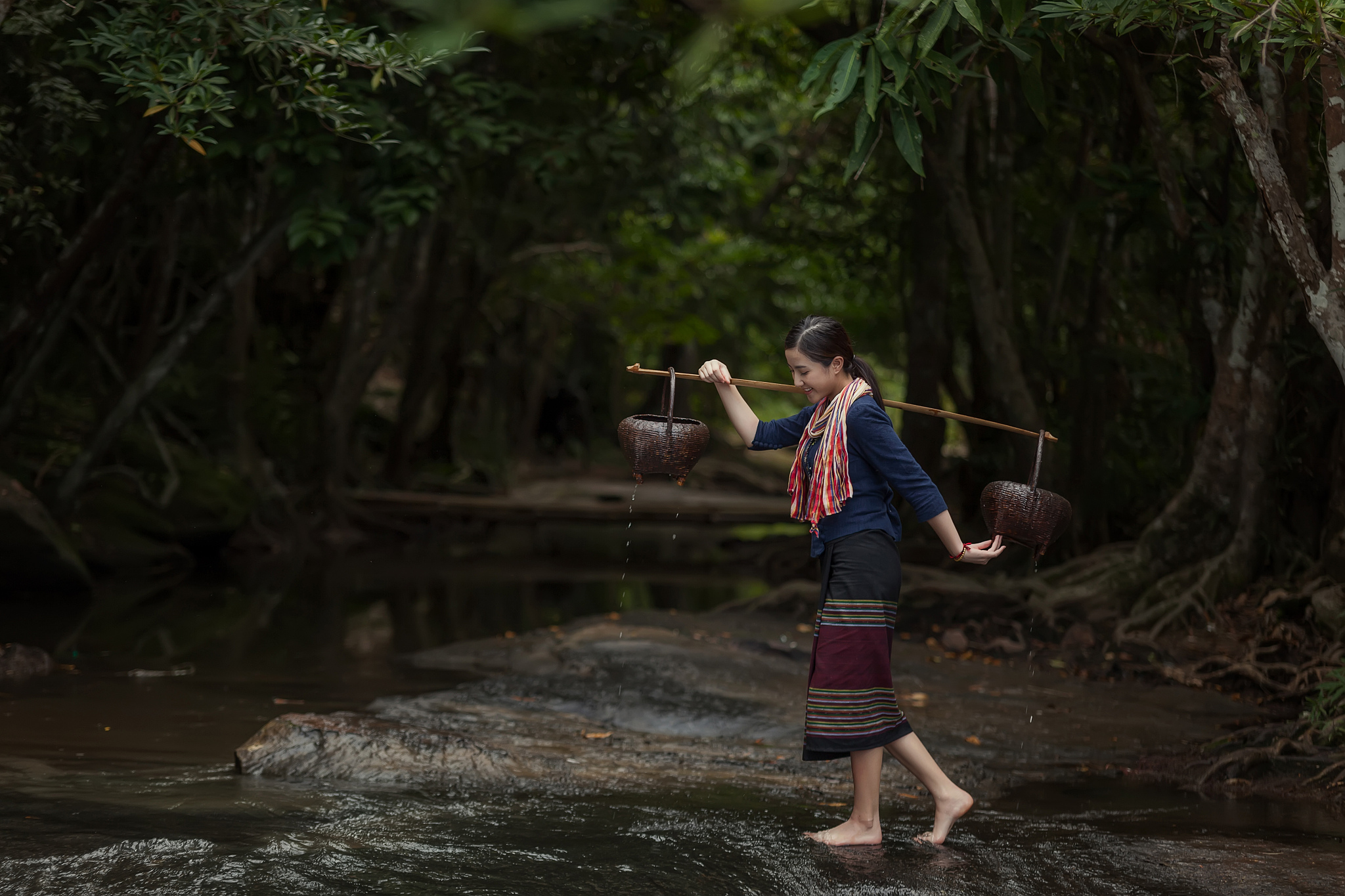 woman wearing traditional thai rural in the forest