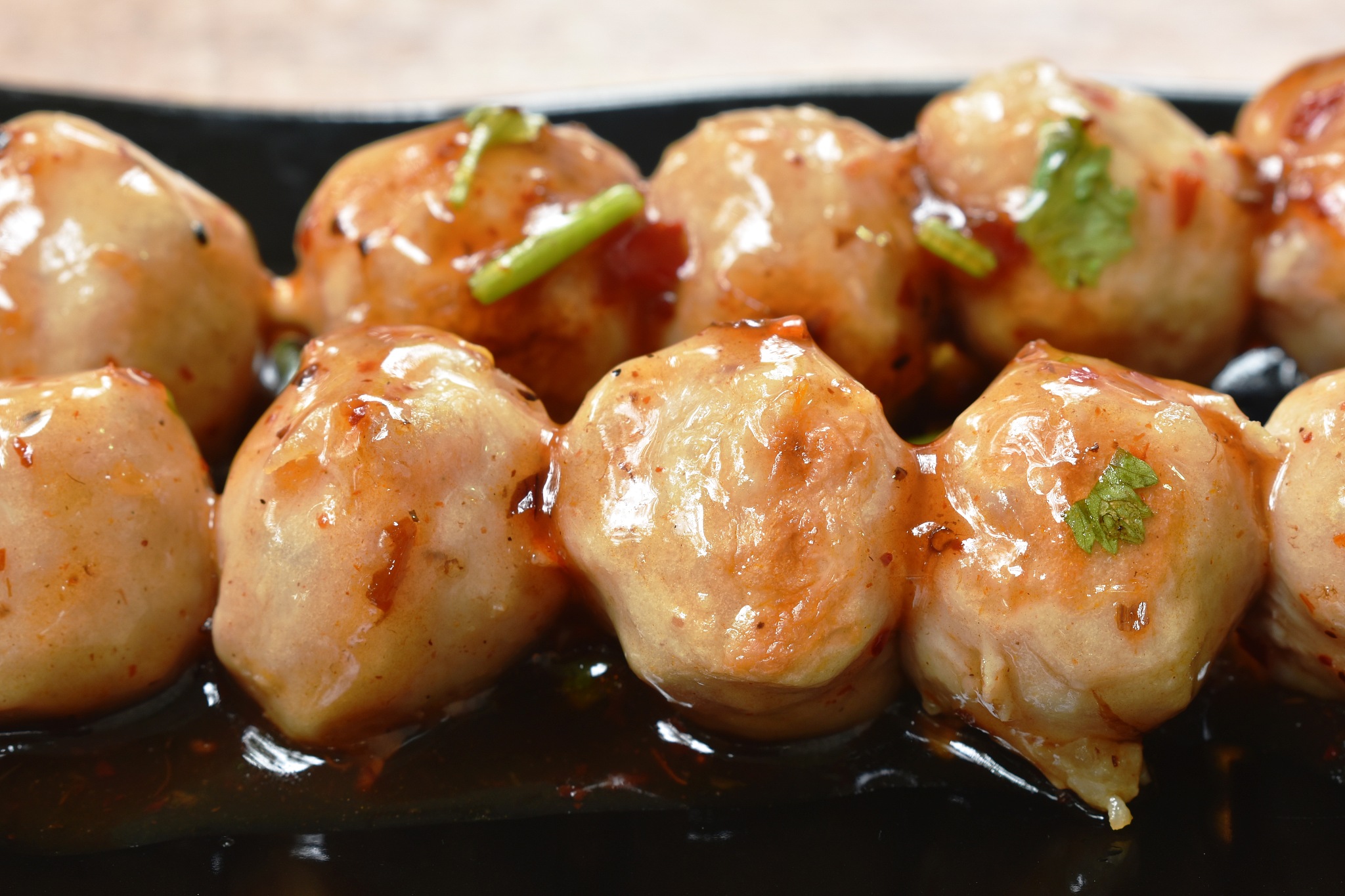 grilled pork tendon meat ball stabbing in wooden stick dressing 