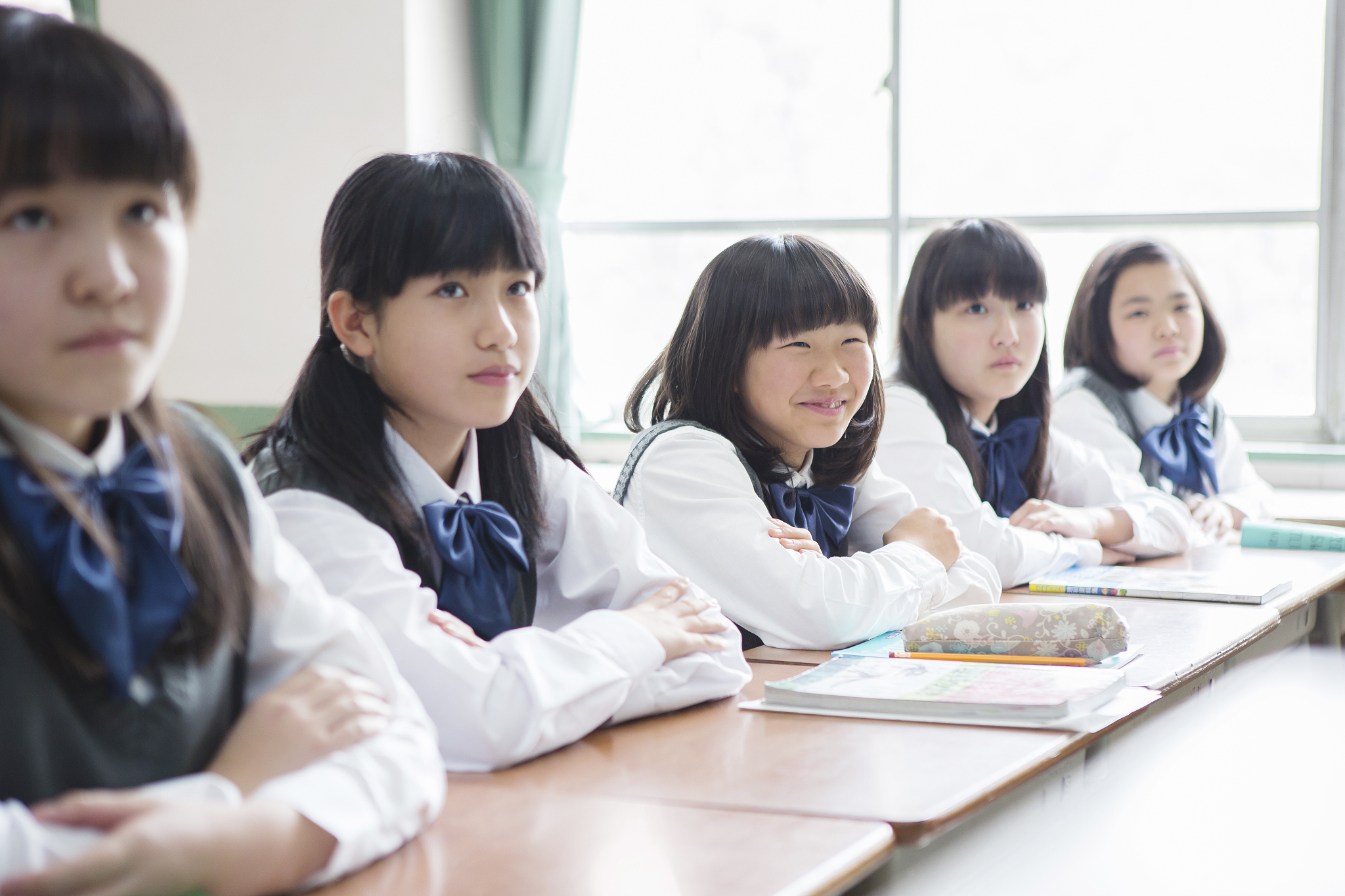 japanese female students to sit in the classroom