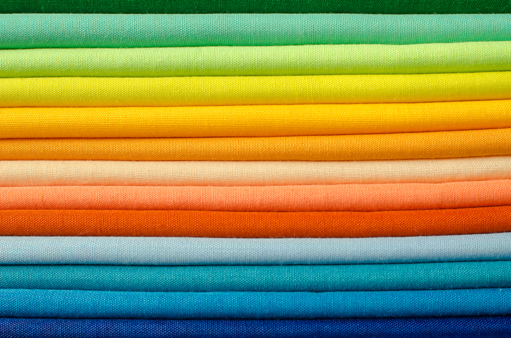 stack of colored fabrics
