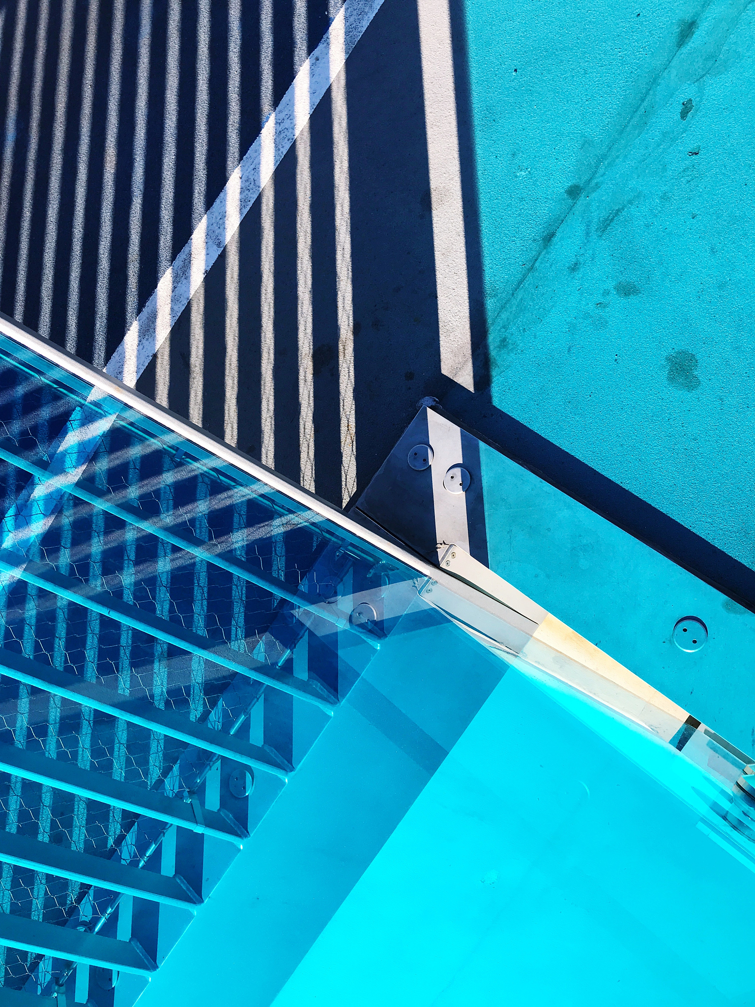 high angle view of fence against wall