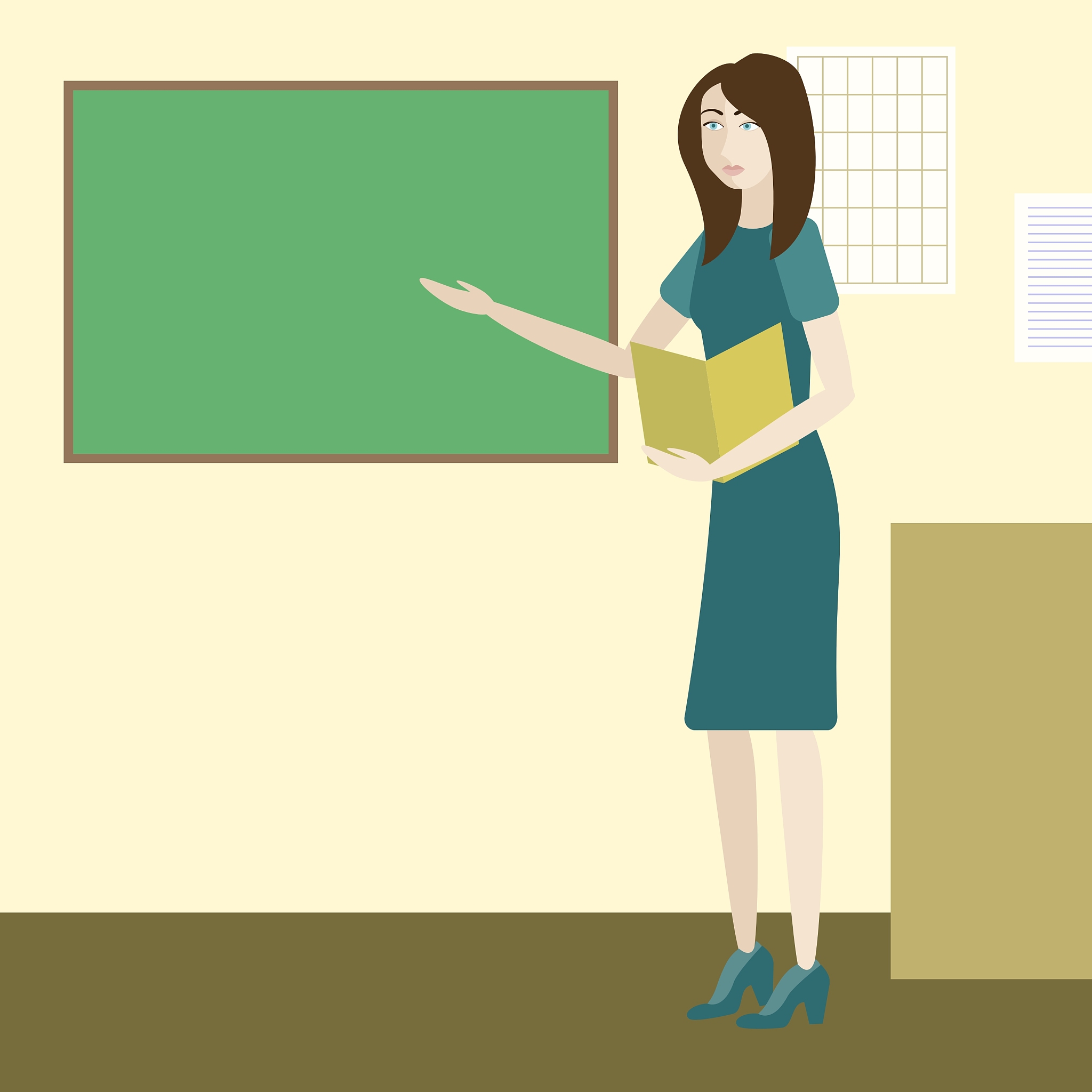 teacher in a classroom standing next to chalkboard