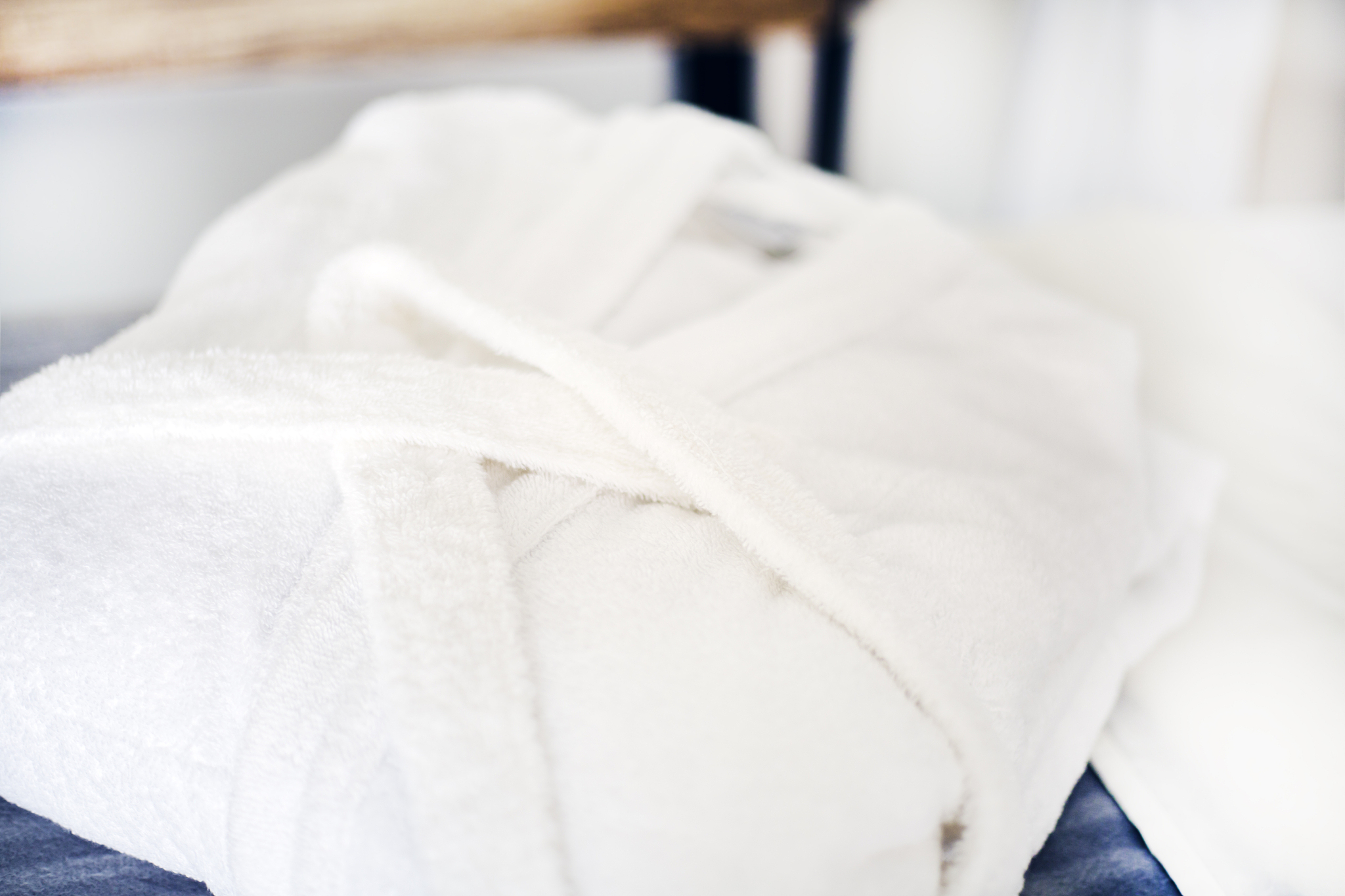 white bathrobe on the bed in the spa salon