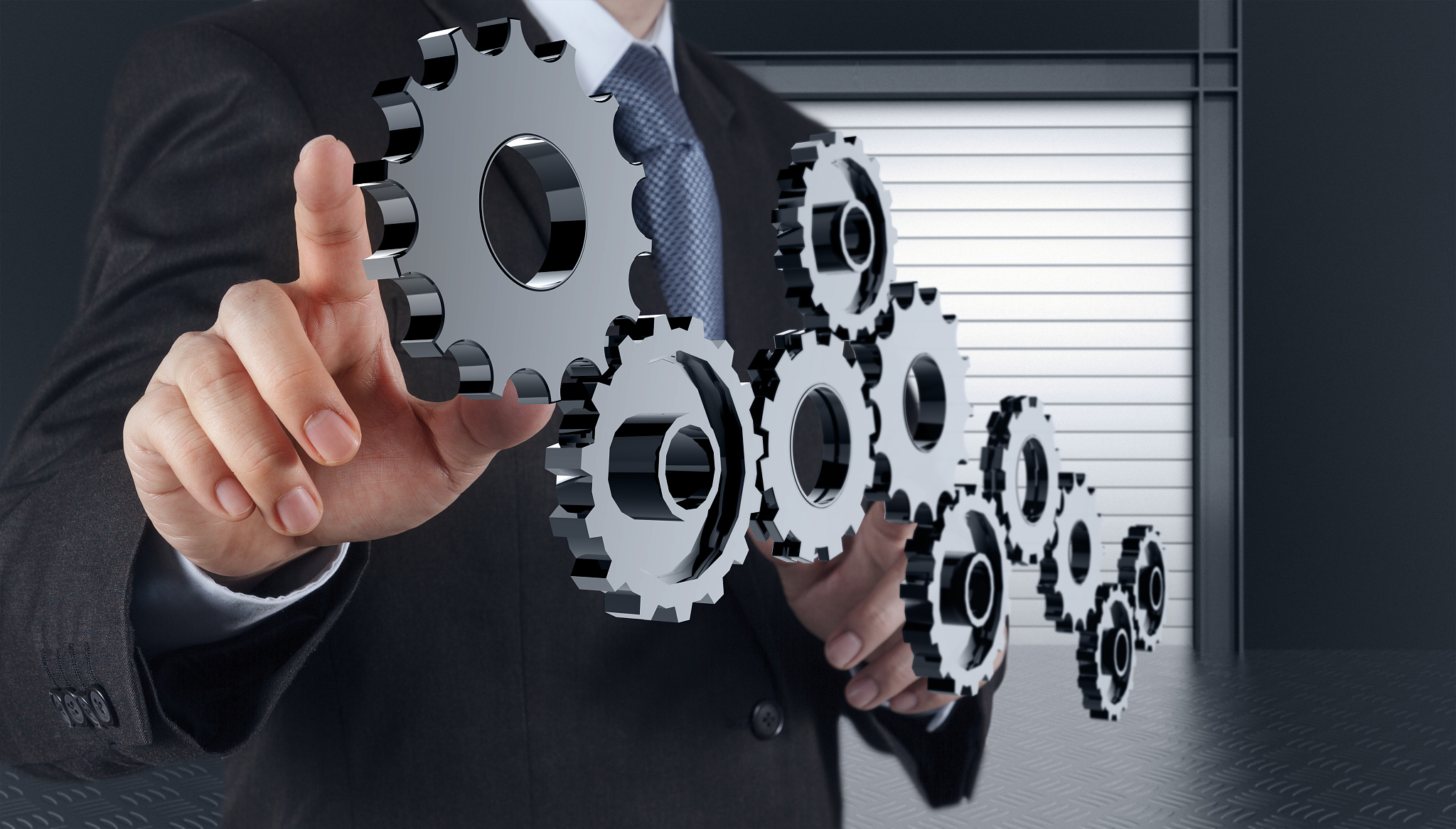 businessman hand show gear to success