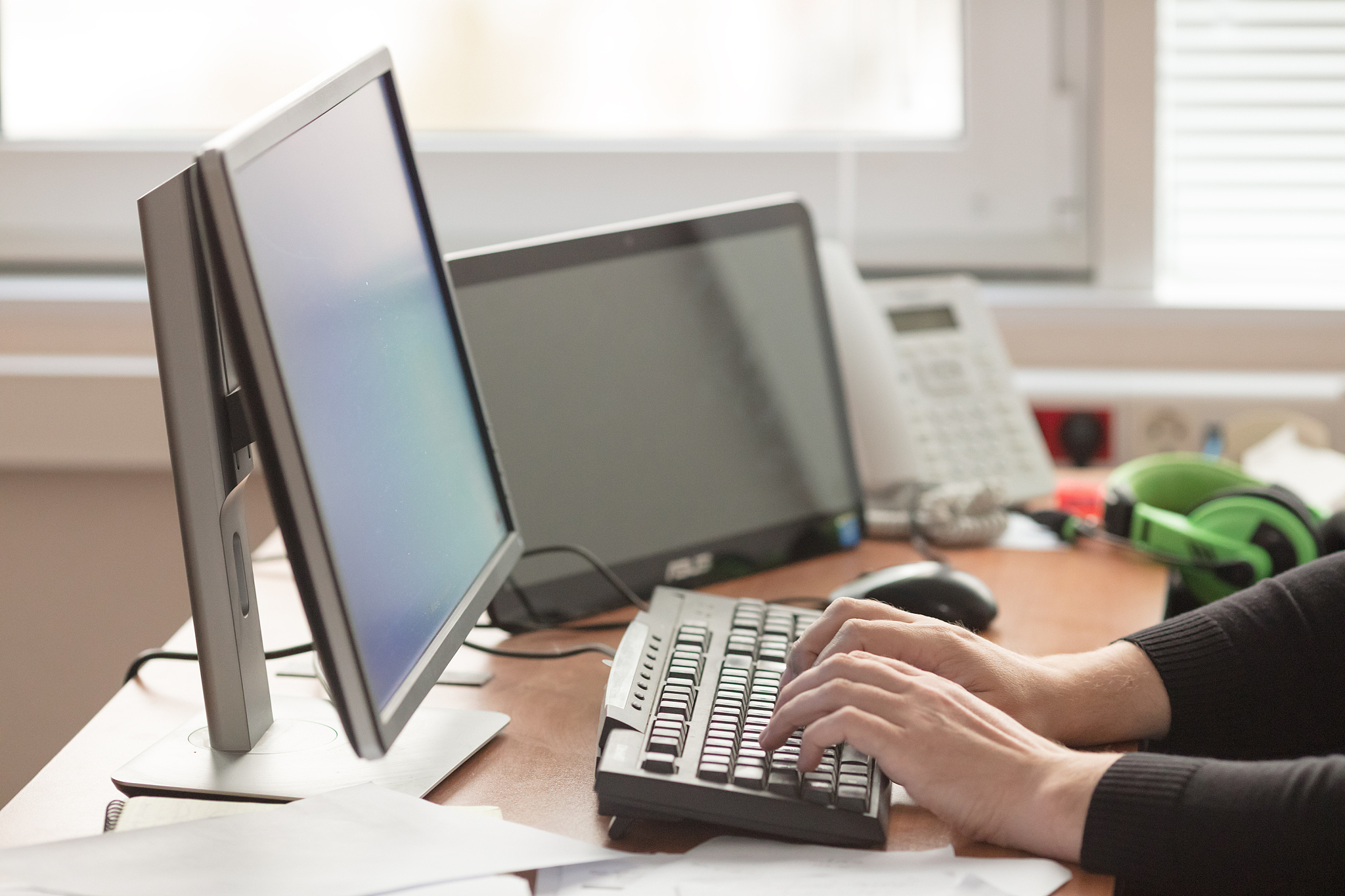 work at  computer in office near window