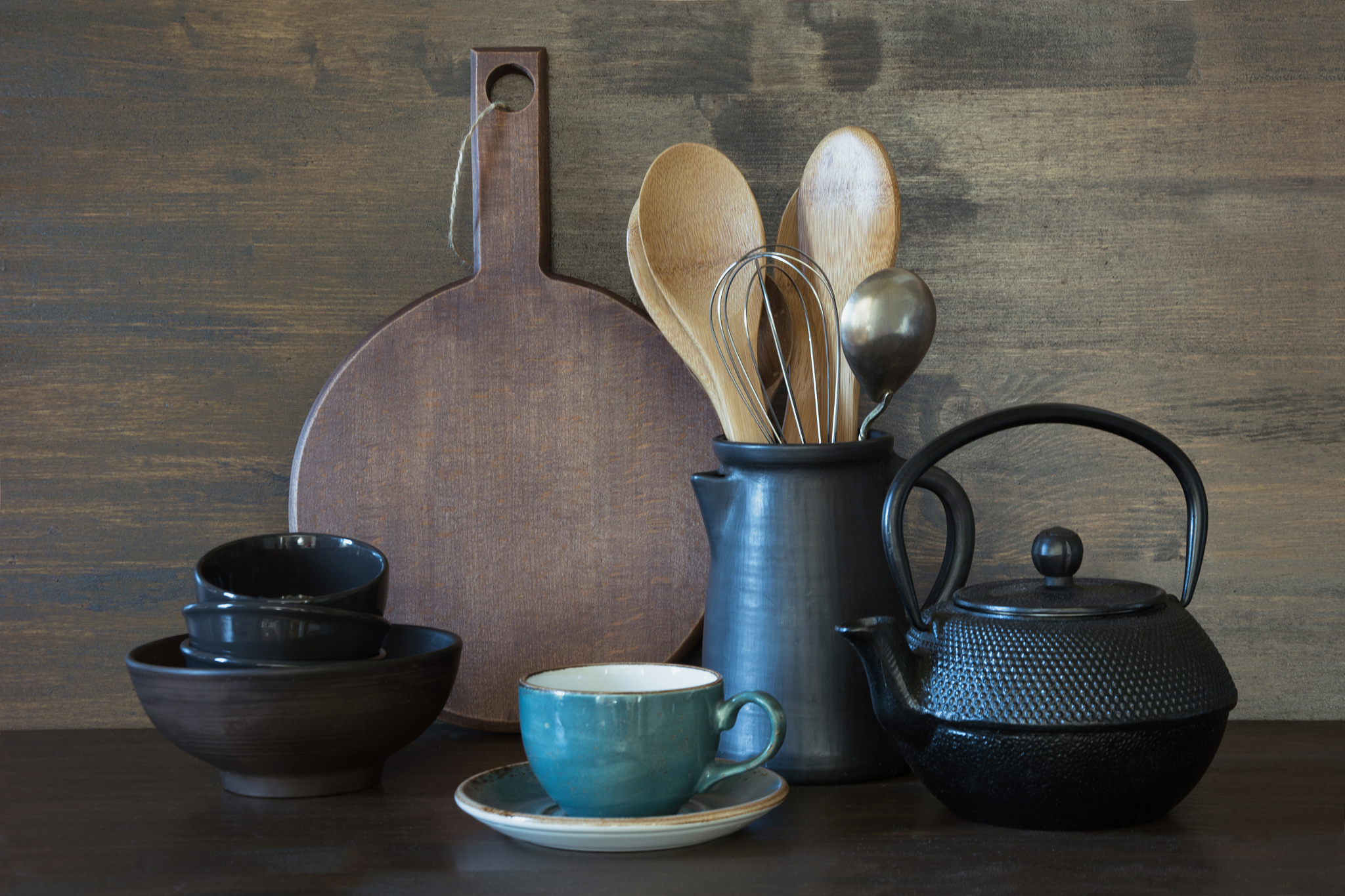 crockery, clayware, dark utensils and other different stuff on w