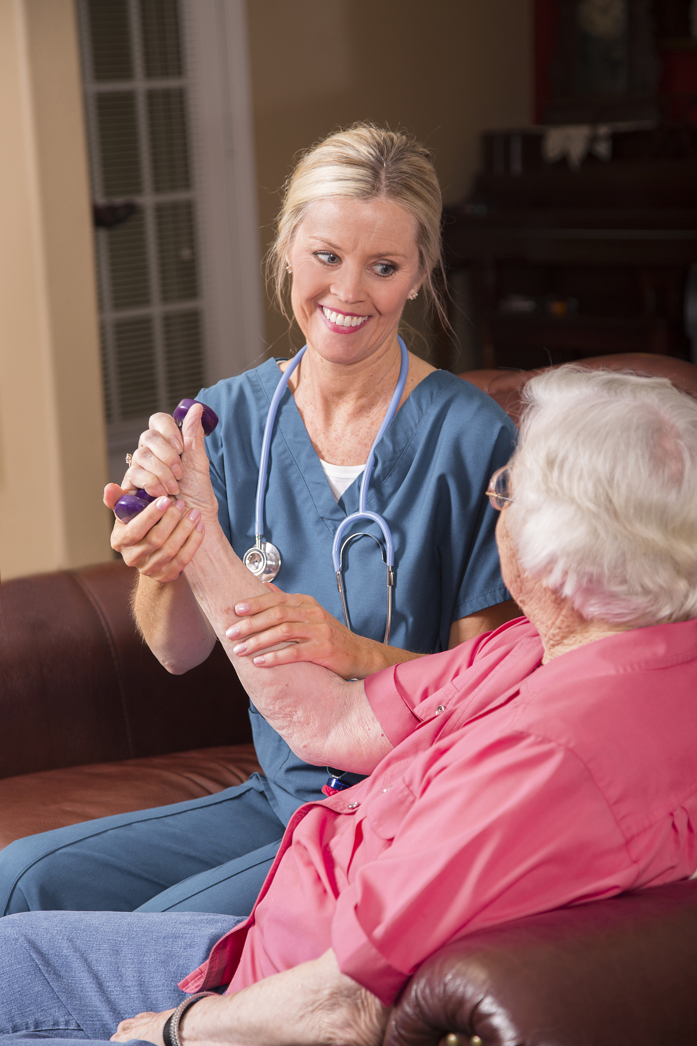 senior adult patient with home healthcare nurse. physical therap