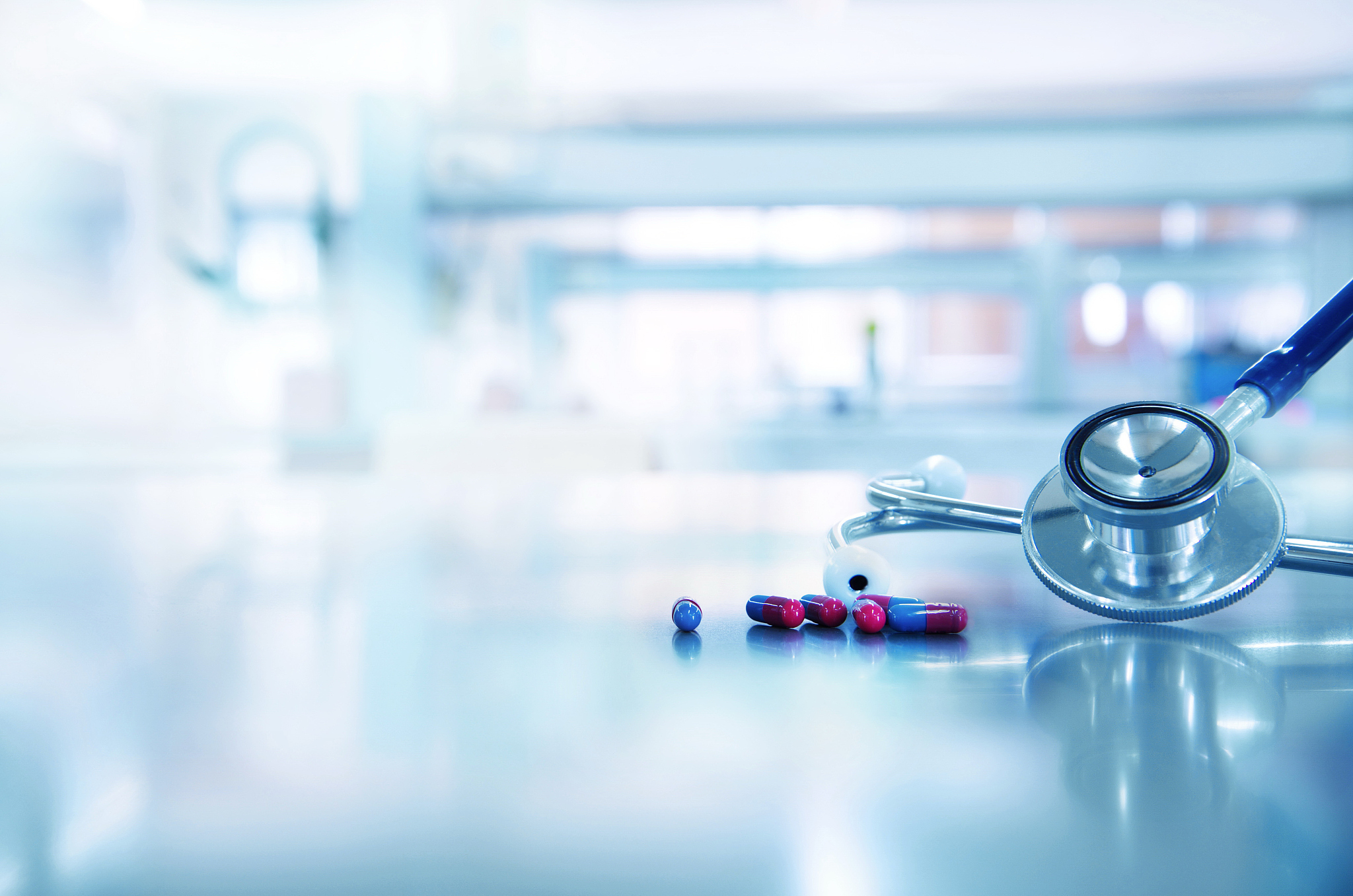 red blue capsule drug with stethoscope for doctor diagnosis rese