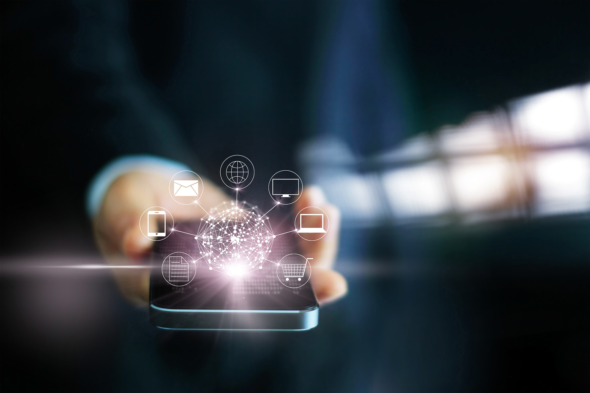 man using mobile payments, holding circle global and icon custom
