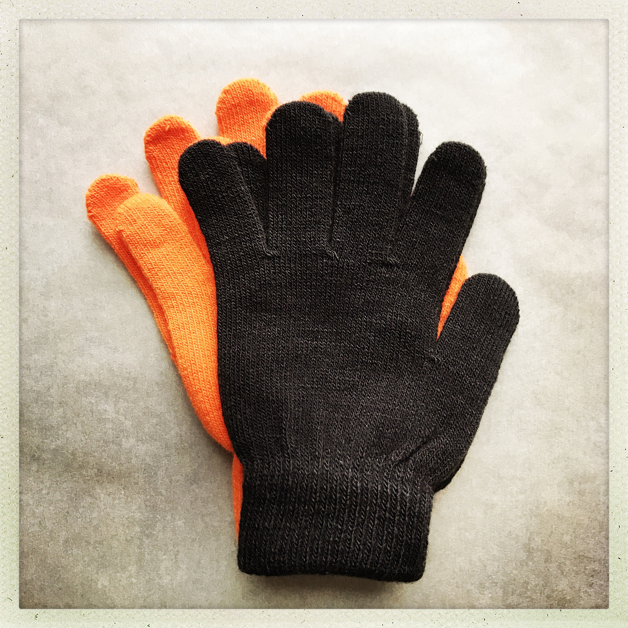 orange and black magic knit gloves