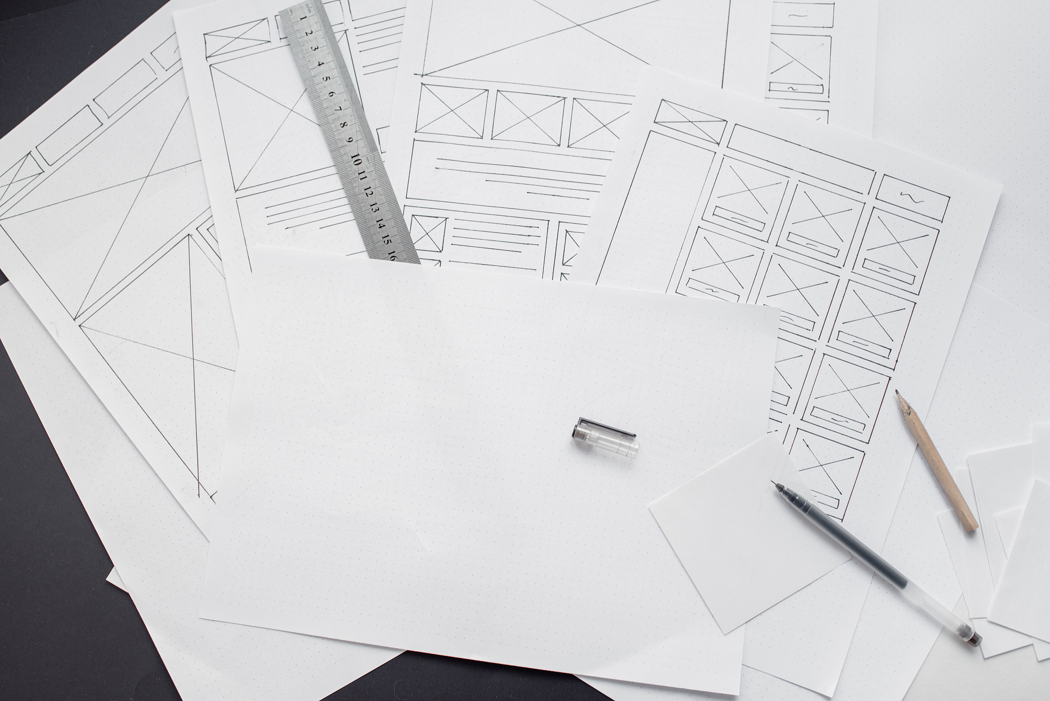 ux website designer drawing wireframe sketch of prototype, frame