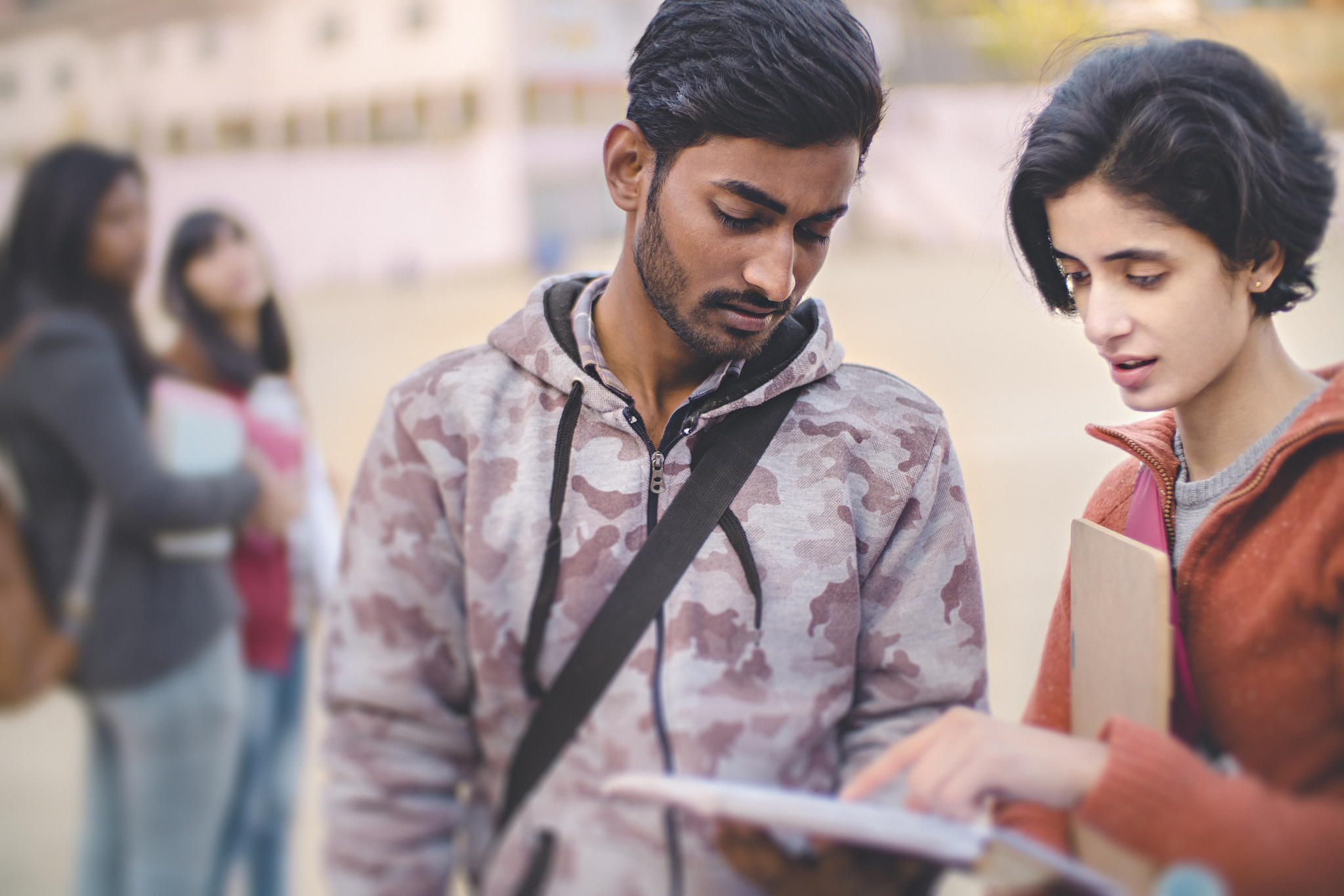 male and female college student friends together.