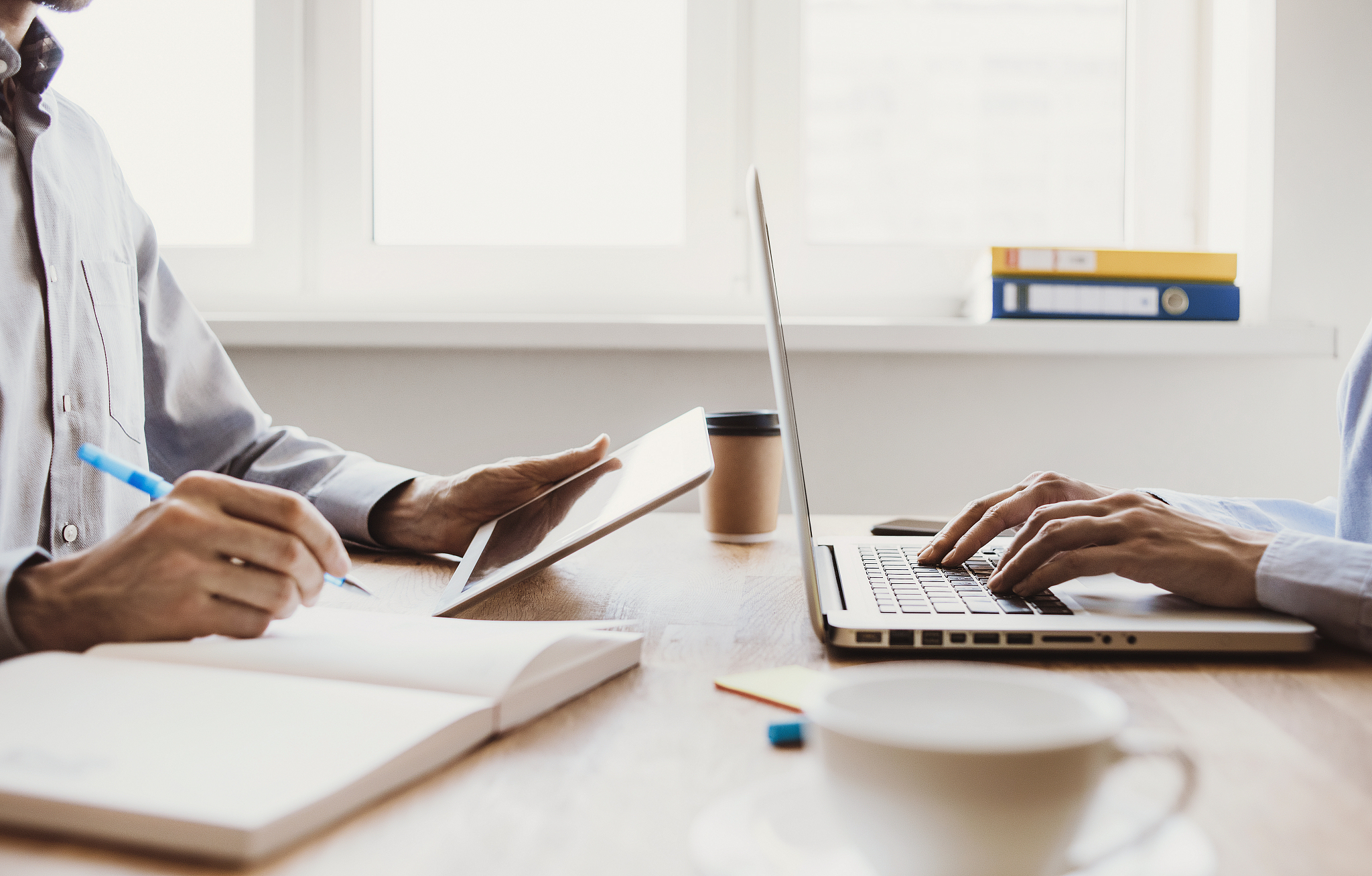 business people working together in office using gadgets