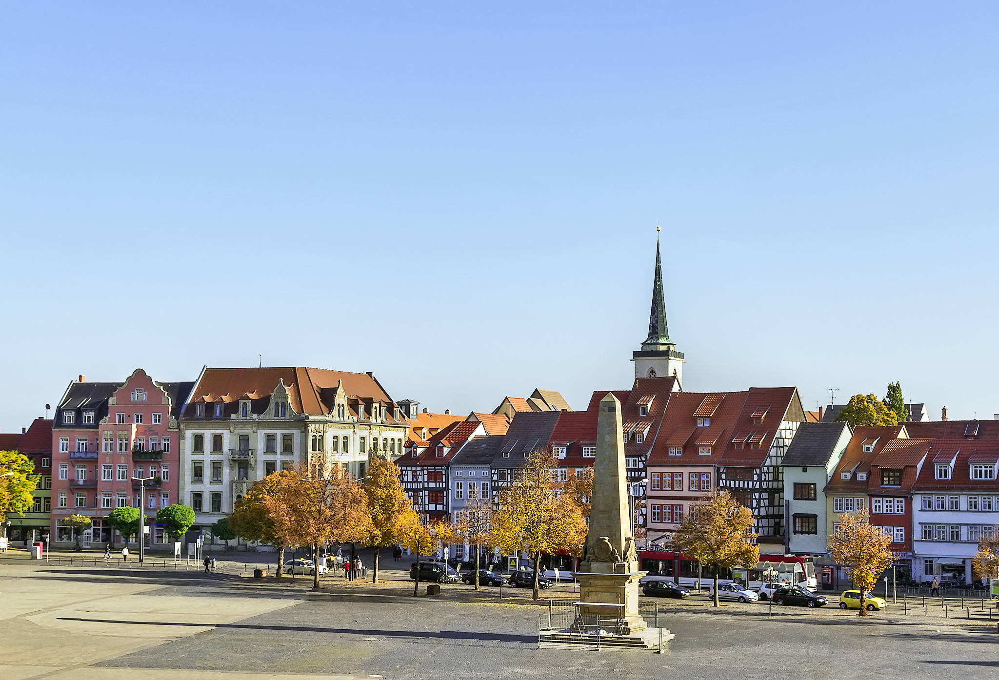 city street by buildings against sky