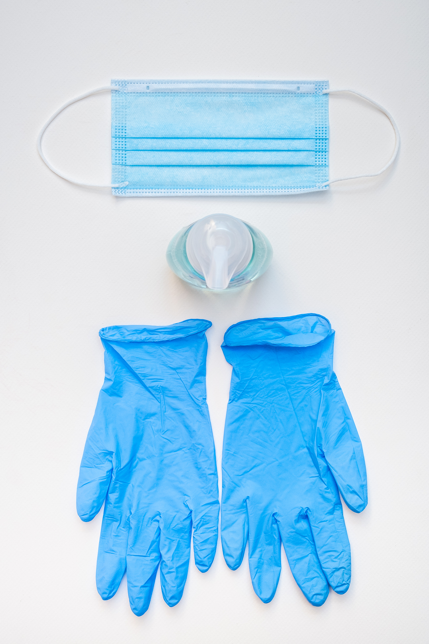 surgical mask, hand sanitizer and latex gloves