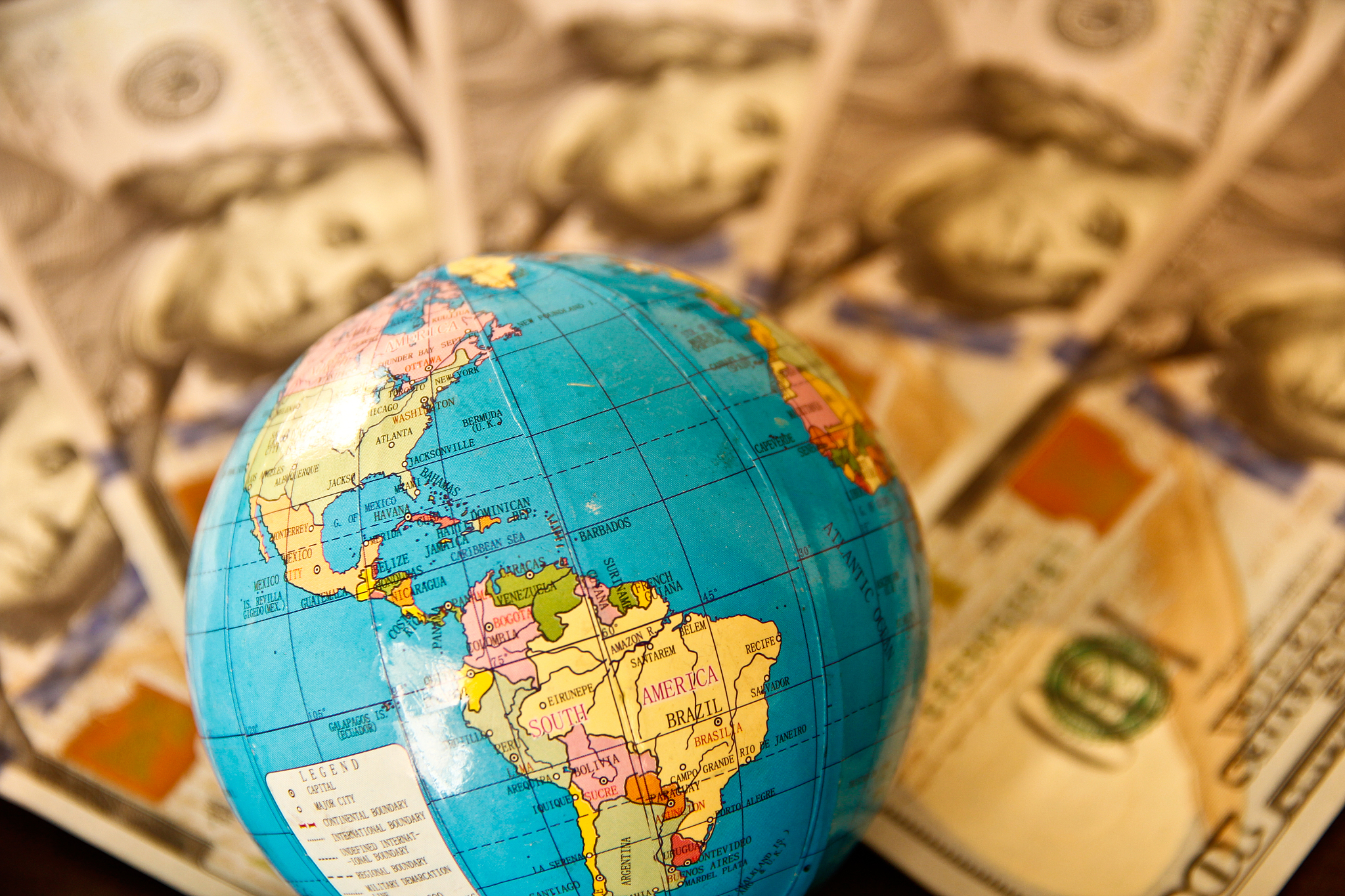 us dollar currency and world globe
