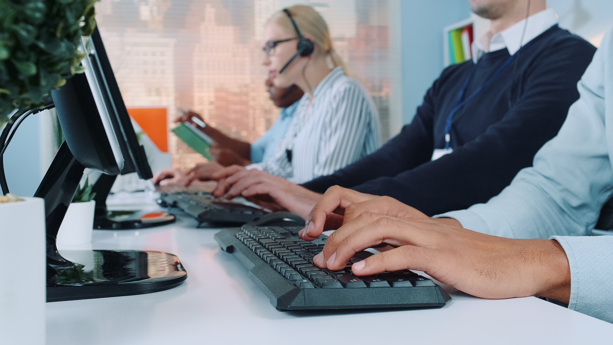 business people using computers on desk in office