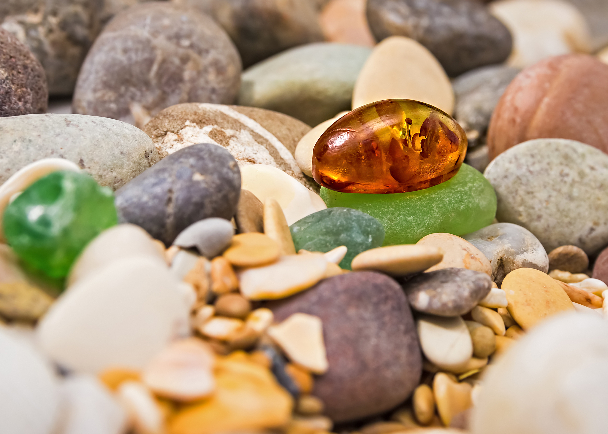 amber stone. mineral amber. rosin yellow amber. sunstone on a be