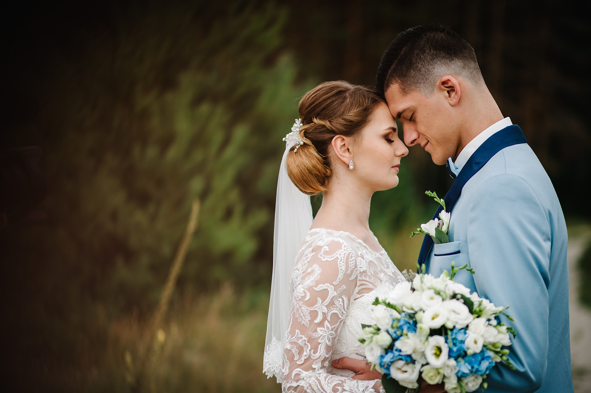 the first meeting is newlyweds on a green field outdoors. bride 