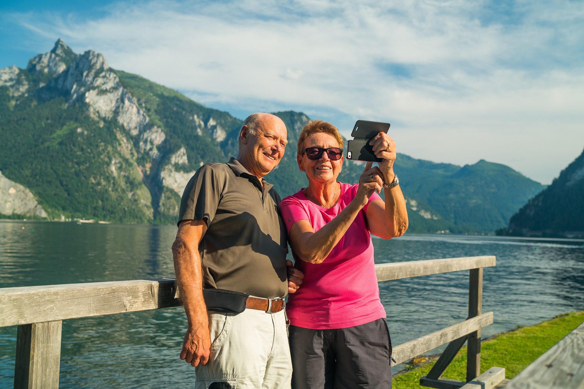 social seniors, taking selfie picture at mountain lake on sunny 