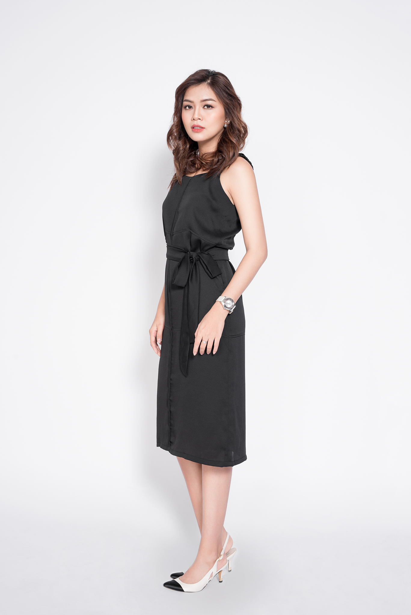 asian woman in elegant casual black outfit posing