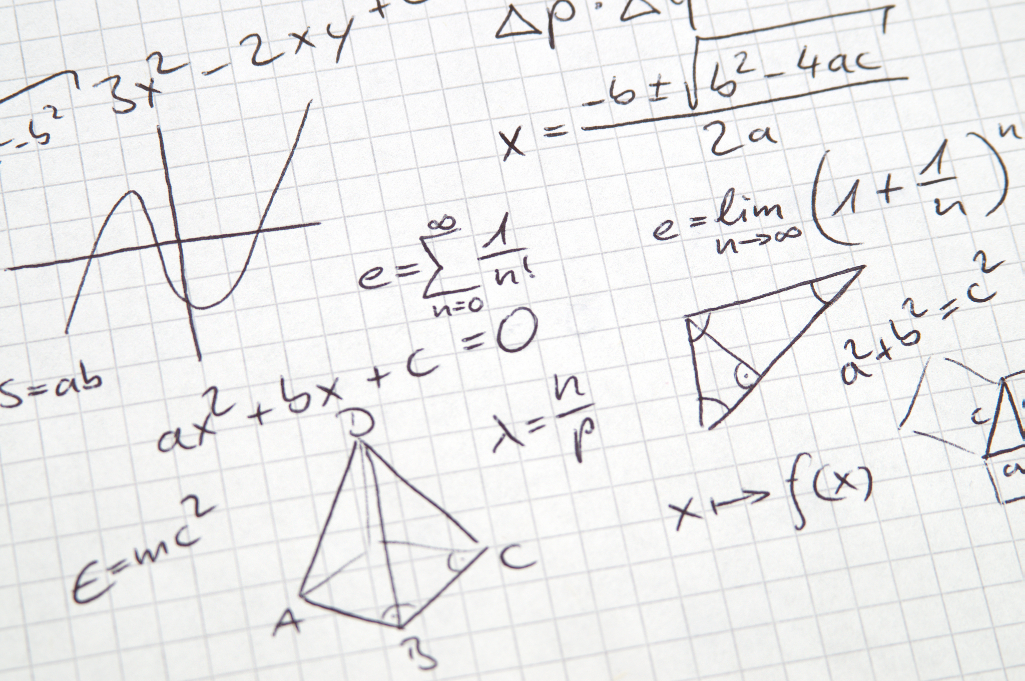 math notes in handwriting on checkered paper